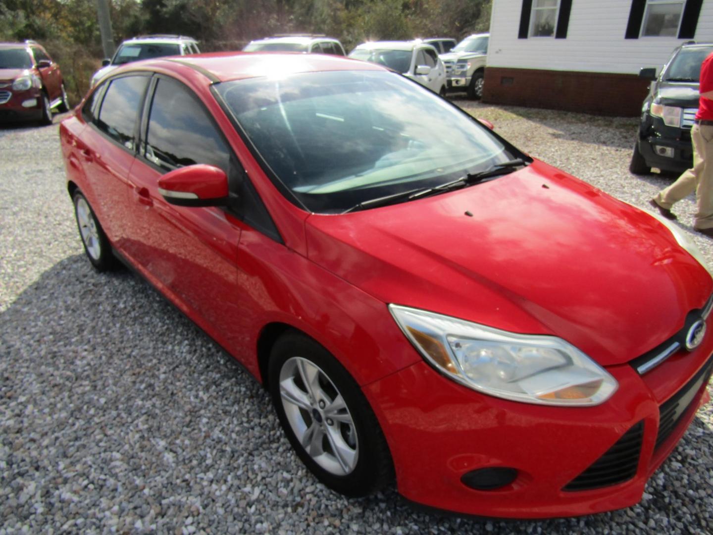 2014 Red Ford Focus (1FADP3F22EL) with an 4 Cyl engine, Automatic transmission, located at 15016 S Hwy 231, Midland City, AL, 36350, (334) 983-3001, 31.306210, -85.495277 - Photo#0