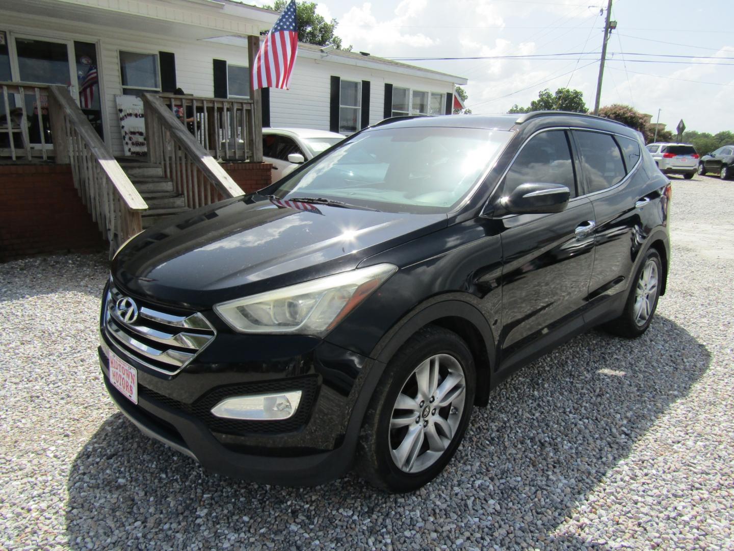 2013 Black /Tan Hyundai Santa Fe Sport 2.0 FWD (5XYZU3LAXDG) with an 2.0L L4 DOHC 16V engine, Automatic transmission, located at 15016 S Hwy 231, Midland City, AL, 36350, (334) 983-3001, 31.306210, -85.495277 - Photo#2