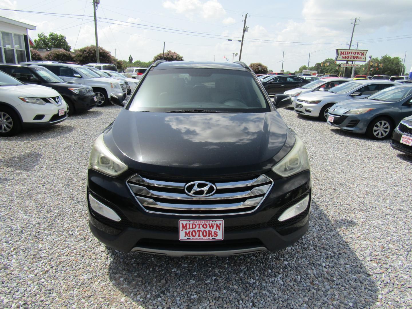 2013 Black /Tan Hyundai Santa Fe Sport 2.0 FWD (5XYZU3LAXDG) with an 2.0L L4 DOHC 16V engine, Automatic transmission, located at 15016 S Hwy 231, Midland City, AL, 36350, (334) 983-3001, 31.306210, -85.495277 - Photo#1