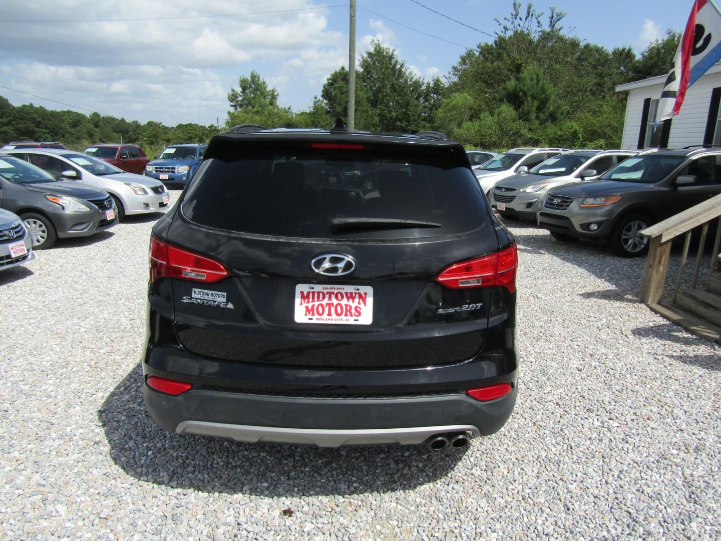 2013 Black /Tan Hyundai Santa Fe Sport 2.0 FWD (5XYZU3LAXDG) with an 2.0L L4 DOHC 16V engine, Automatic transmission, located at 15016 S Hwy 231, Midland City, AL, 36350, (334) 983-3001, 31.306210, -85.495277 - Photo#6