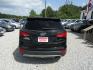 2013 Black /Tan Hyundai Santa Fe Sport 2.0 FWD (5XYZU3LAXDG) with an 2.0L L4 DOHC 16V engine, Automatic transmission, located at 15016 S Hwy 231, Midland City, AL, 36350, (334) 983-3001, 31.306210, -85.495277 - Photo#6