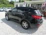 2013 Black /Tan Hyundai Santa Fe Sport 2.0 FWD (5XYZU3LAXDG) with an 2.0L L4 DOHC 16V engine, Automatic transmission, located at 15016 S Hwy 231, Midland City, AL, 36350, (334) 983-3001, 31.306210, -85.495277 - Photo#5