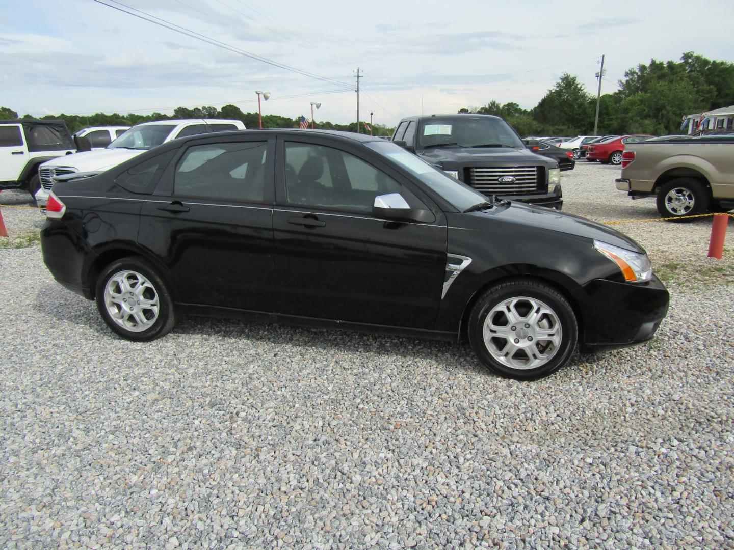 2008 Black /Black Ford Focus SES Sedan (1FAHP35N08W) with an 2.0L L4 DOHC 16V engine, Automatic transmission, located at 15016 S Hwy 231, Midland City, AL, 36350, (334) 983-3001, 31.306210, -85.495277 - Photo#0