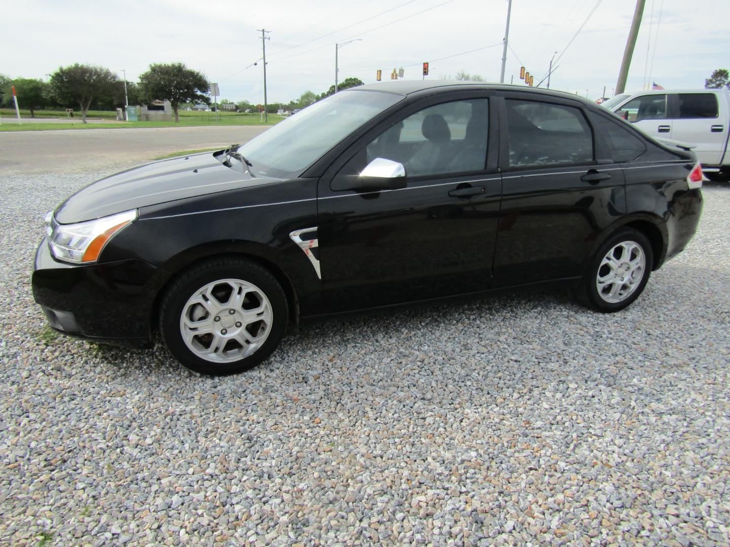 2008 Black /Black Ford Focus SES Sedan (1FAHP35N08W) with an 2.0L L4 DOHC 16V engine, Automatic transmission, located at 15016 S Hwy 231, Midland City, AL, 36350, (334) 983-3001, 31.306210, -85.495277 - Photo#2