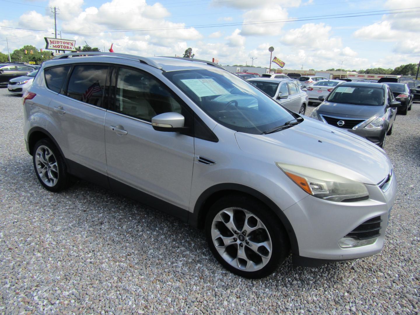 2014 Silver /Gray Ford Escape Titanium FWD (1FMCU0J96EU) with an 2.0L L4 DOHC 16V engine, Automatic transmission, located at 15016 S Hwy 231, Midland City, AL, 36350, (334) 983-3001, 31.306210, -85.495277 - Photo#0