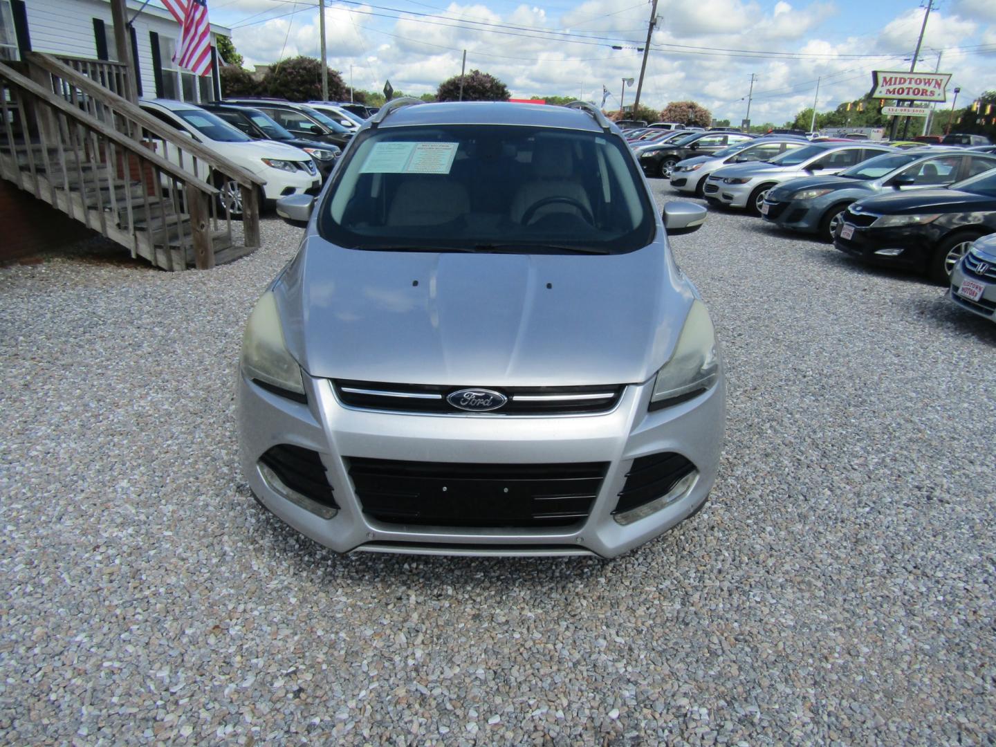 2014 Silver /Gray Ford Escape Titanium FWD (1FMCU0J96EU) with an 2.0L L4 DOHC 16V engine, Automatic transmission, located at 15016 S Hwy 231, Midland City, AL, 36350, (334) 983-3001, 31.306210, -85.495277 - Photo#1