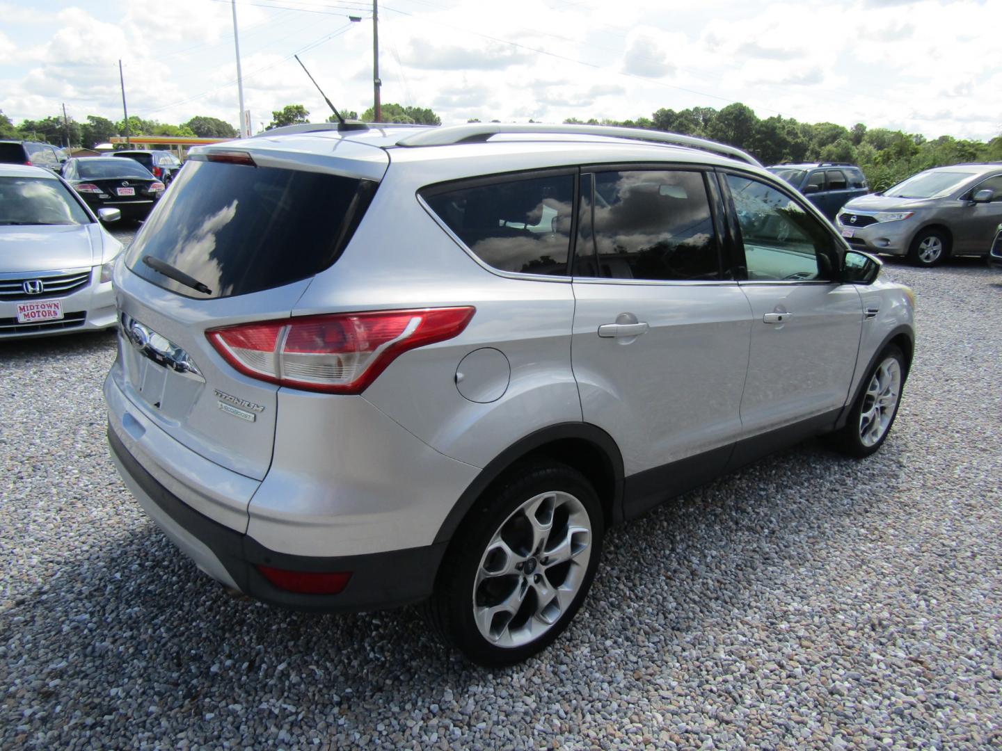 2014 Silver /Gray Ford Escape Titanium FWD (1FMCU0J96EU) with an 2.0L L4 DOHC 16V engine, Automatic transmission, located at 15016 S Hwy 231, Midland City, AL, 36350, (334) 983-3001, 31.306210, -85.495277 - Photo#7