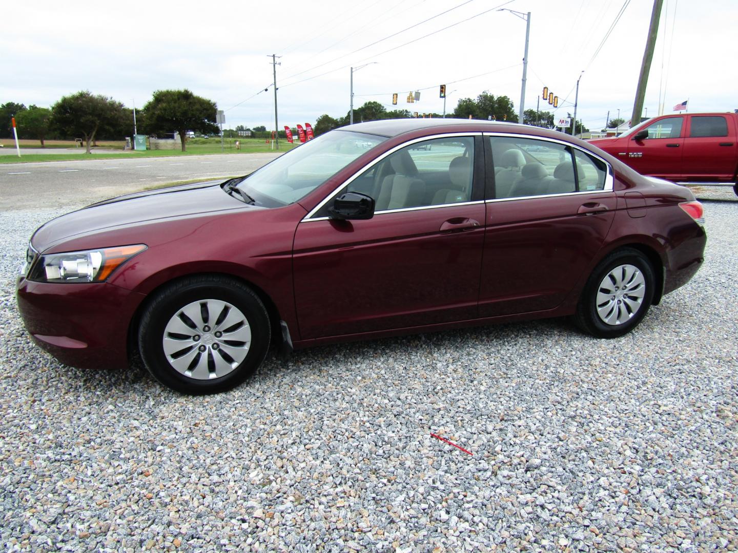 2009 Burgandy /Tan Honda Accord LX Sedan AT (1HGCP263X9A) with an 2.4L L4 DOHC 16V engine, Automatic transmission, located at 15016 S Hwy 231, Midland City, AL, 36350, (334) 983-3001, 31.306210, -85.495277 - Photo#2