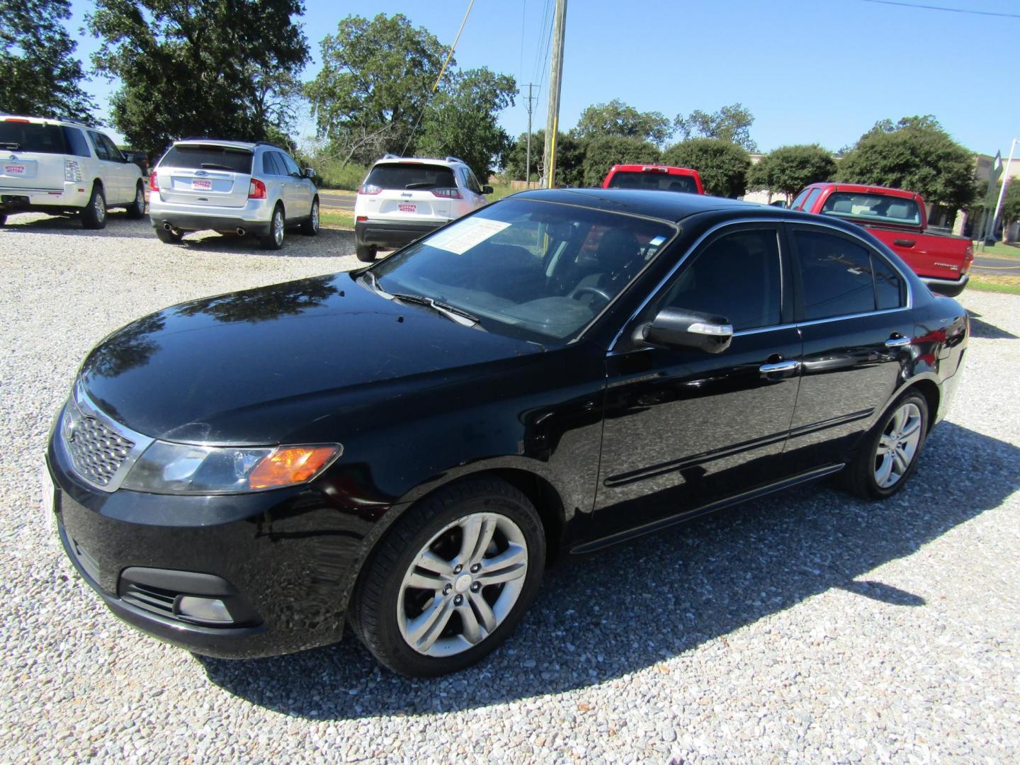 2009 Black /Gray Kia Optima EX (KNAGE228495) with an 2.4L L4 DOHC 16V engine, Automatic transmission, located at 15016 S Hwy 231, Midland City, AL, 36350, (334) 983-3001, 31.306210, -85.495277 - Photo#2