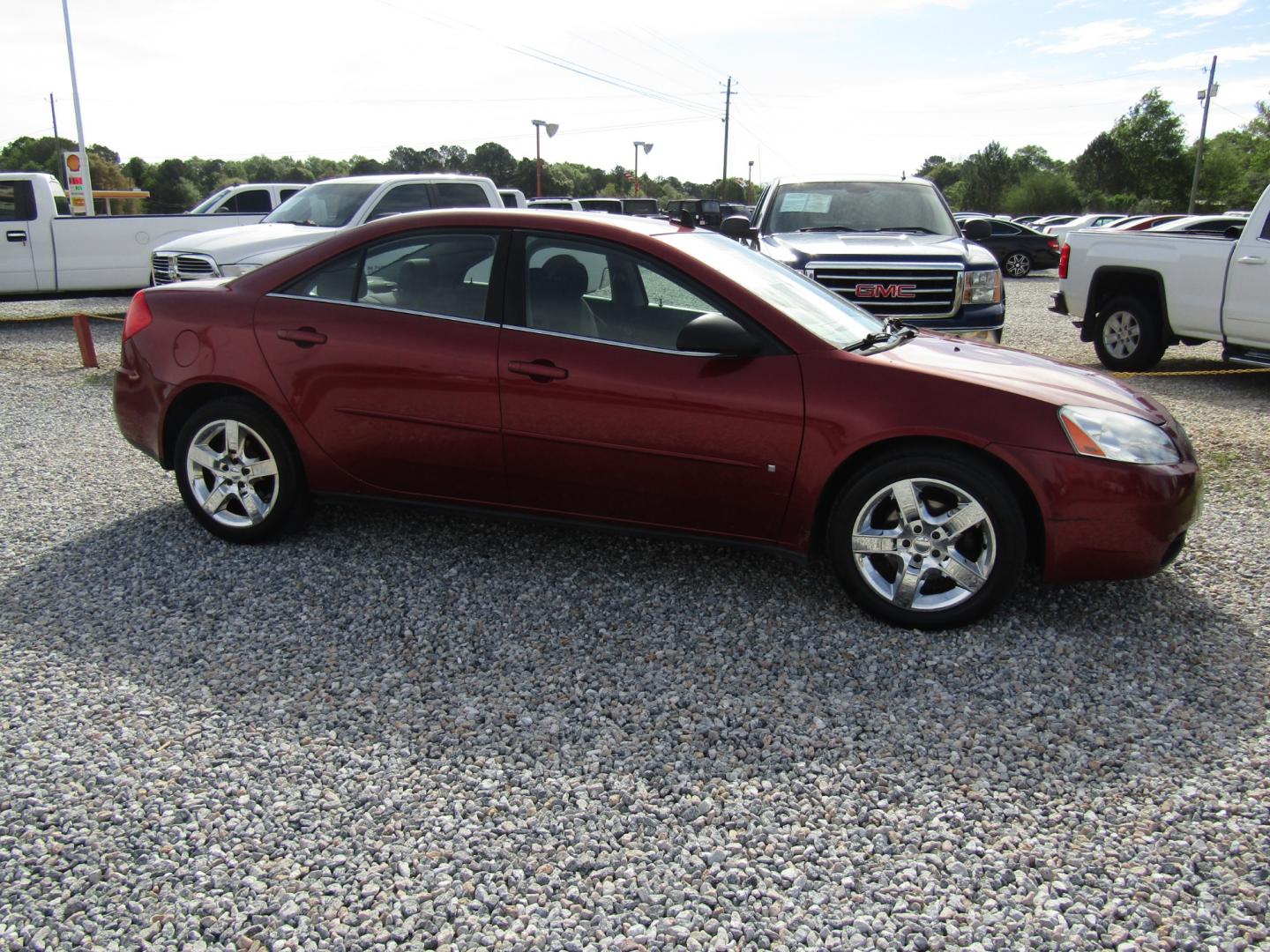 2009 Red /Black Pontiac G6 Sedan (1G2ZG57B494) with an 2.4L L4 DOHC 16V engine, Automatic transmission, located at 15016 S Hwy 231, Midland City, AL, 36350, (334) 983-3001, 31.306210, -85.495277 - Photo#0