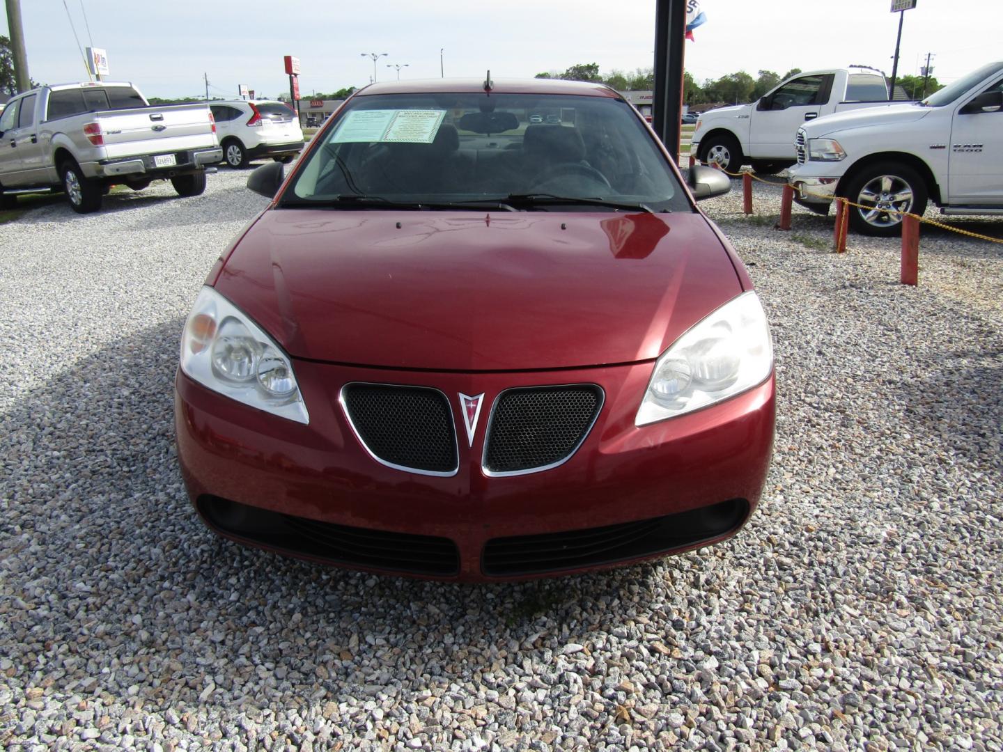 2009 Red /Black Pontiac G6 Sedan (1G2ZG57B494) with an 2.4L L4 DOHC 16V engine, Automatic transmission, located at 15016 S Hwy 231, Midland City, AL, 36350, (334) 983-3001, 31.306210, -85.495277 - Photo#1