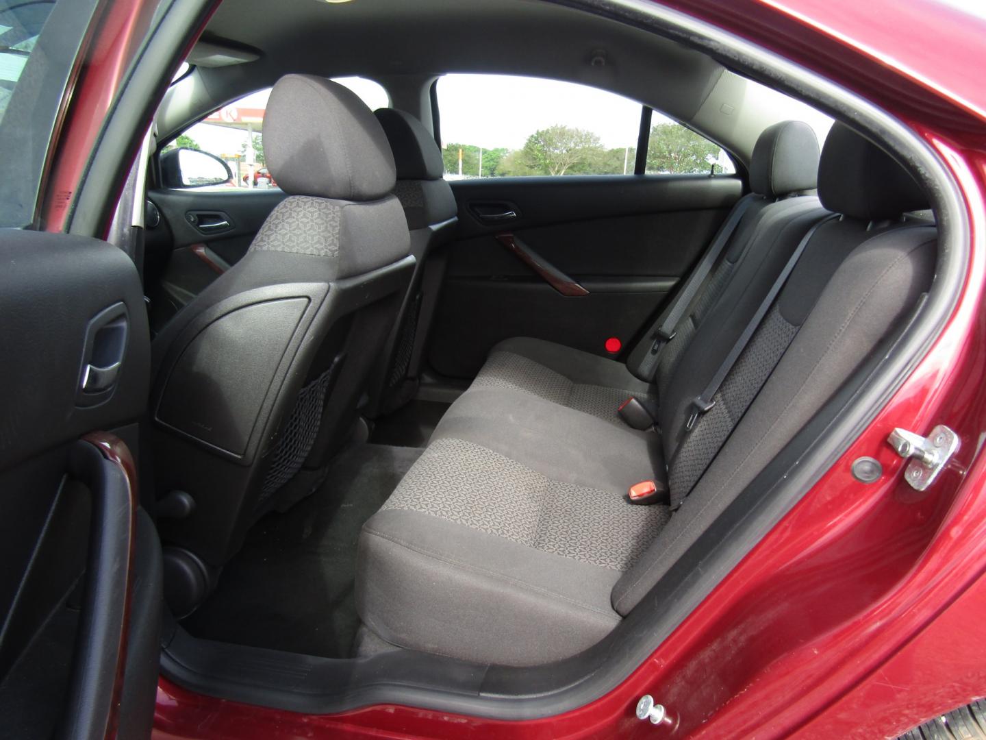 2009 Red /Black Pontiac G6 Sedan (1G2ZG57B494) with an 2.4L L4 DOHC 16V engine, Automatic transmission, located at 15016 S Hwy 231, Midland City, AL, 36350, (334) 983-3001, 31.306210, -85.495277 - Photo#4