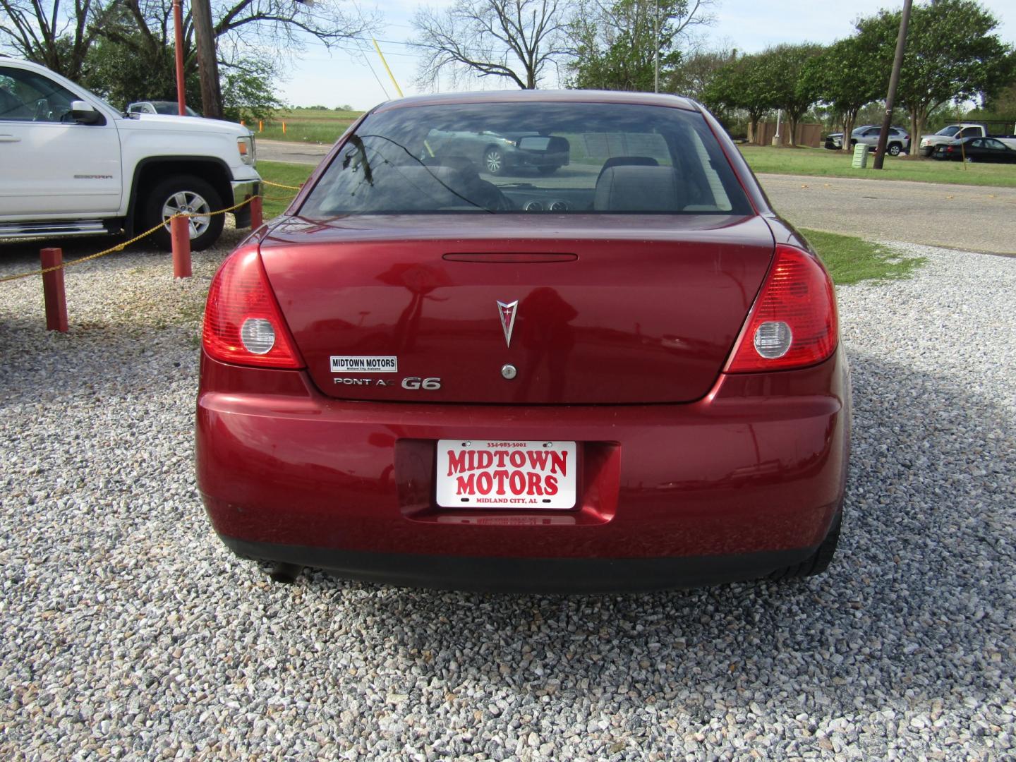 2009 Red /Black Pontiac G6 Sedan (1G2ZG57B494) with an 2.4L L4 DOHC 16V engine, Automatic transmission, located at 15016 S Hwy 231, Midland City, AL, 36350, (334) 983-3001, 31.306210, -85.495277 - Photo#6