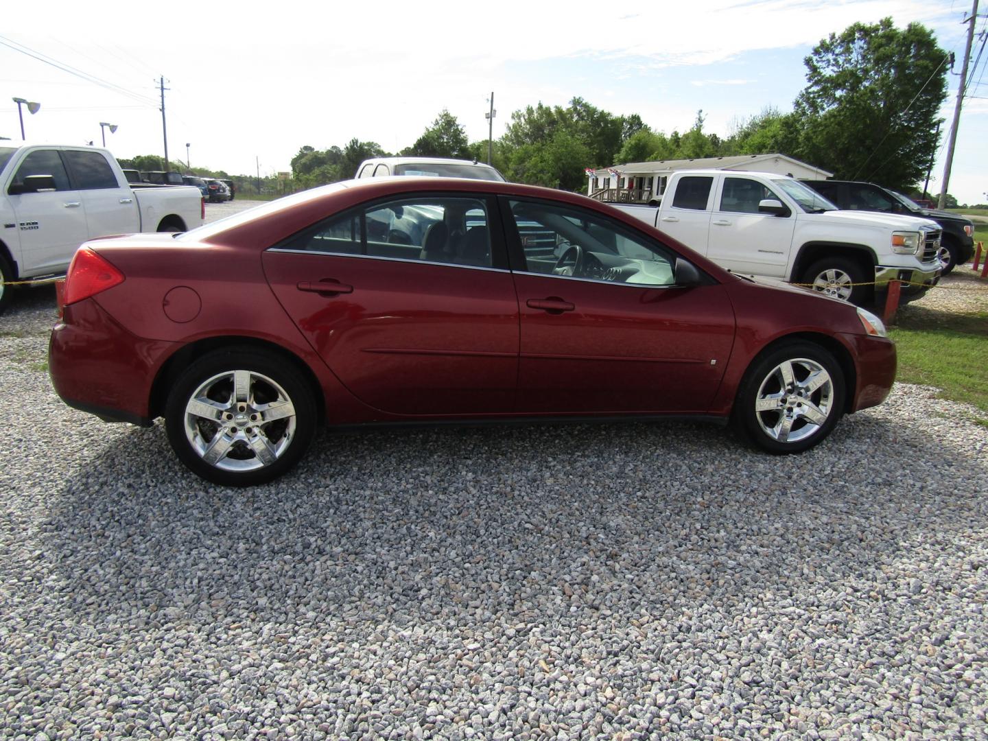 2009 Red /Black Pontiac G6 Sedan (1G2ZG57B494) with an 2.4L L4 DOHC 16V engine, Automatic transmission, located at 15016 S Hwy 231, Midland City, AL, 36350, (334) 983-3001, 31.306210, -85.495277 - Photo#7