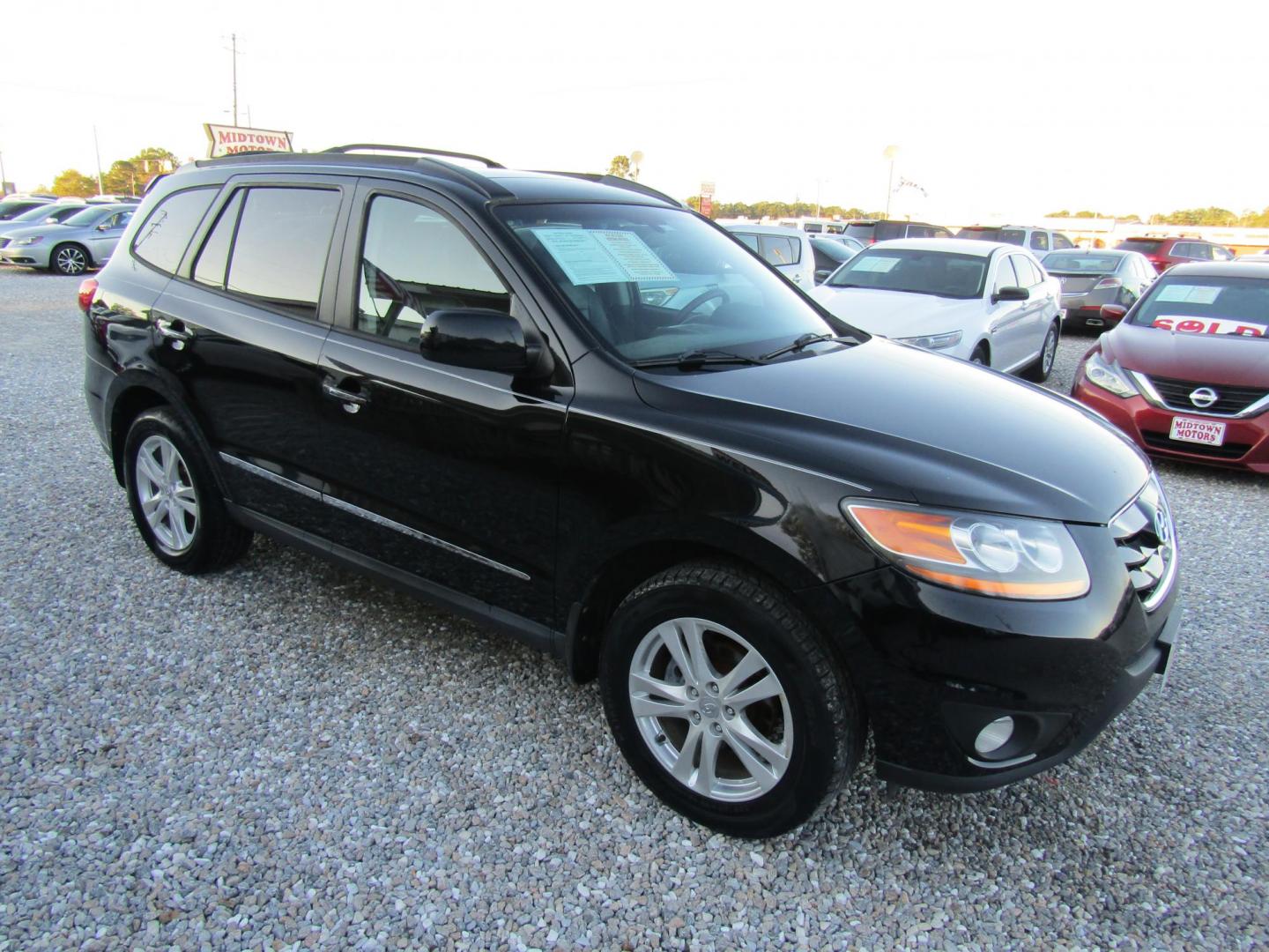 2011 Black /Black Hyundai Santa Fe Limited 3.5 FWD (5XYZK4AG4BG) with an 3.5L V6 DOHC 24V engine, Automatic transmission, located at 15016 S Hwy 231, Midland City, AL, 36350, (334) 983-3001, 31.306210, -85.495277 - Photo#0