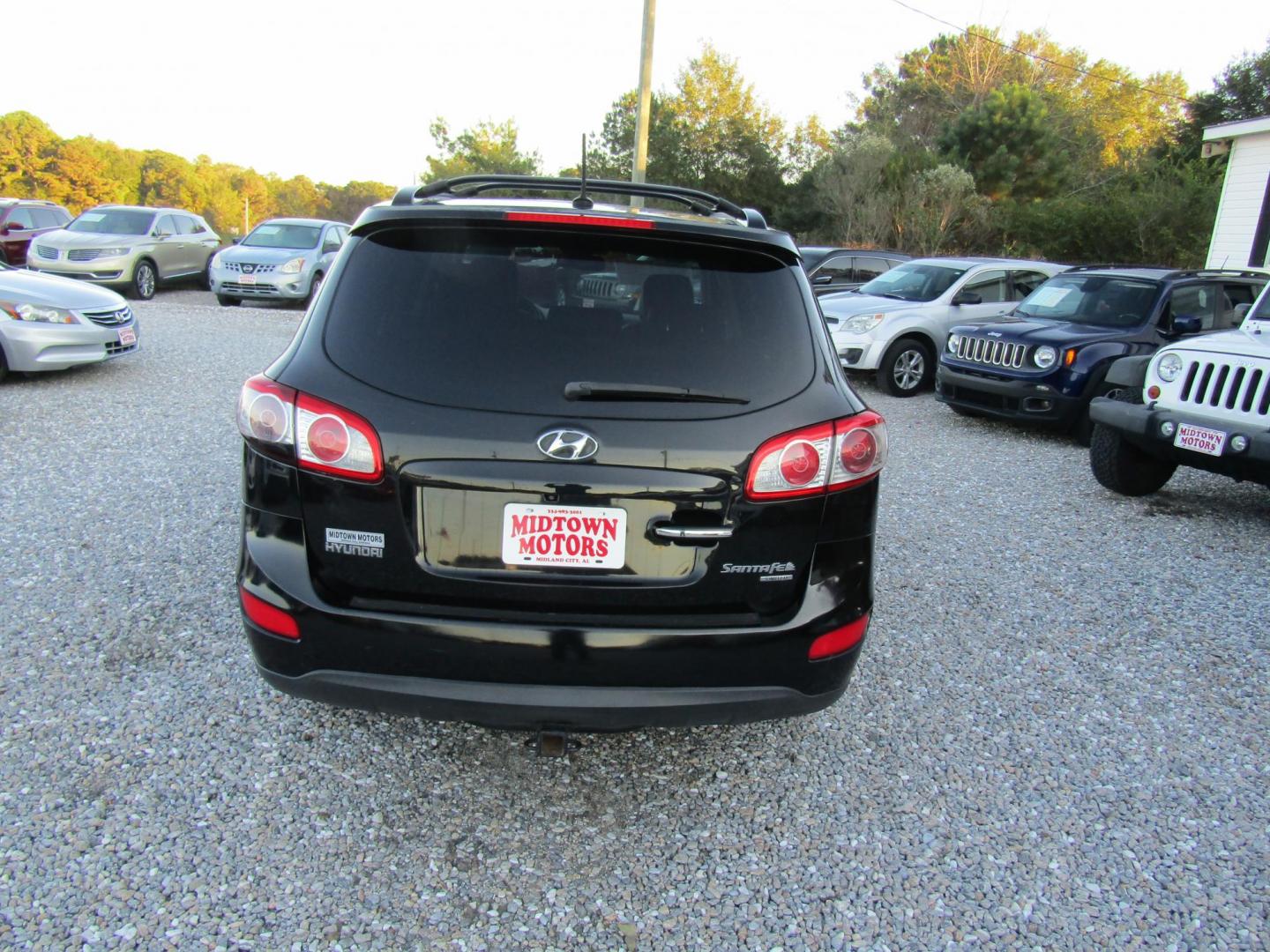 2011 Black /Black Hyundai Santa Fe Limited 3.5 FWD (5XYZK4AG4BG) with an 3.5L V6 DOHC 24V engine, Automatic transmission, located at 15016 S Hwy 231, Midland City, AL, 36350, (334) 983-3001, 31.306210, -85.495277 - Photo#5