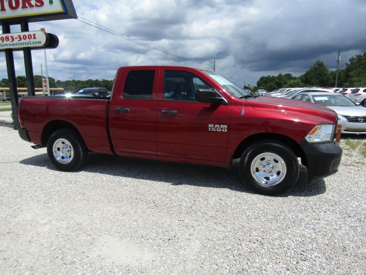 2013 Maroon /Black RAM 1500 Tradesman Quad Cab 2WD (1C6RR6FP3DS) with an 4.7L V8 SOHC 16V engine, Automatic transmission, located at 15016 S Hwy 231, Midland City, AL, 36350, (334) 983-3001, 31.306210, -85.495277 - Photo#0