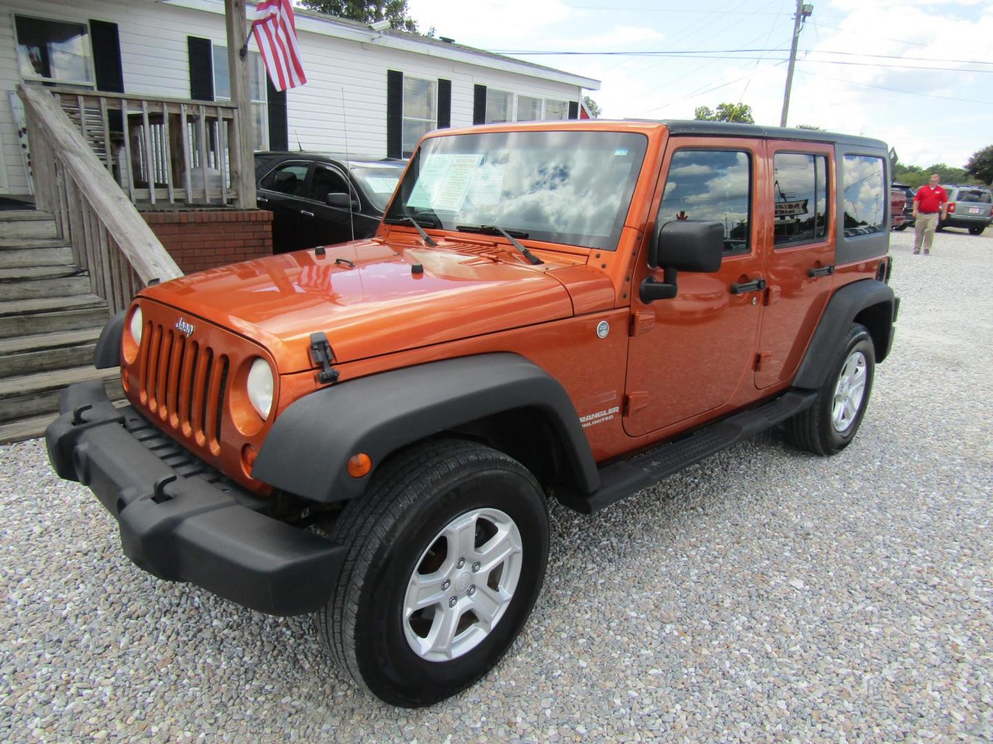 2011 Orange /Black Jeep Wrangler Unlimited Sport 4WD (1J4BA3H16BL) with an 3.8L V6 OHV 12V engine, Automatic transmission, located at 15016 S Hwy 231, Midland City, AL, 36350, (334) 983-3001, 31.306210, -85.495277 - Photo#2