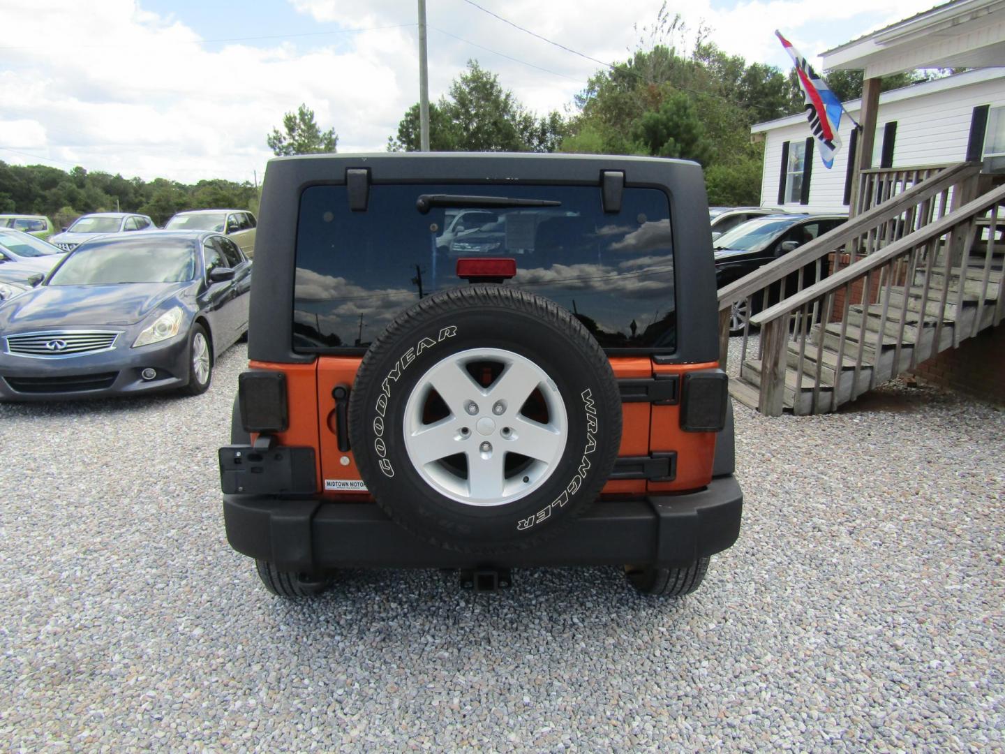 2011 Orange /Black Jeep Wrangler Unlimited Sport 4WD (1J4BA3H16BL) with an 3.8L V6 OHV 12V engine, Automatic transmission, located at 15016 S Hwy 231, Midland City, AL, 36350, (334) 983-3001, 31.306210, -85.495277 - Photo#6