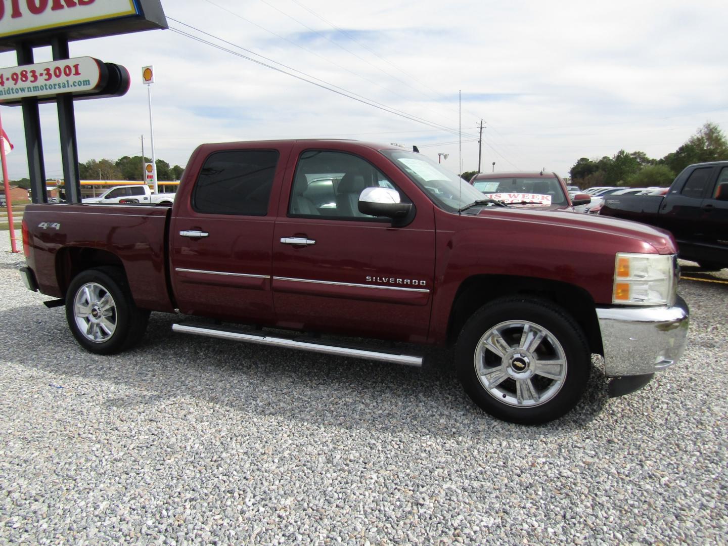 2013 Burgandy /Gray Chevrolet Silverado 1500 LT Crew Cab 4WD (3GCPKSE78DG) with an 5.3L V8 OHV 16V FFV engine, Automatic transmission, located at 15016 S Hwy 231, Midland City, AL, 36350, (334) 983-3001, 31.306210, -85.495277 - Photo#0