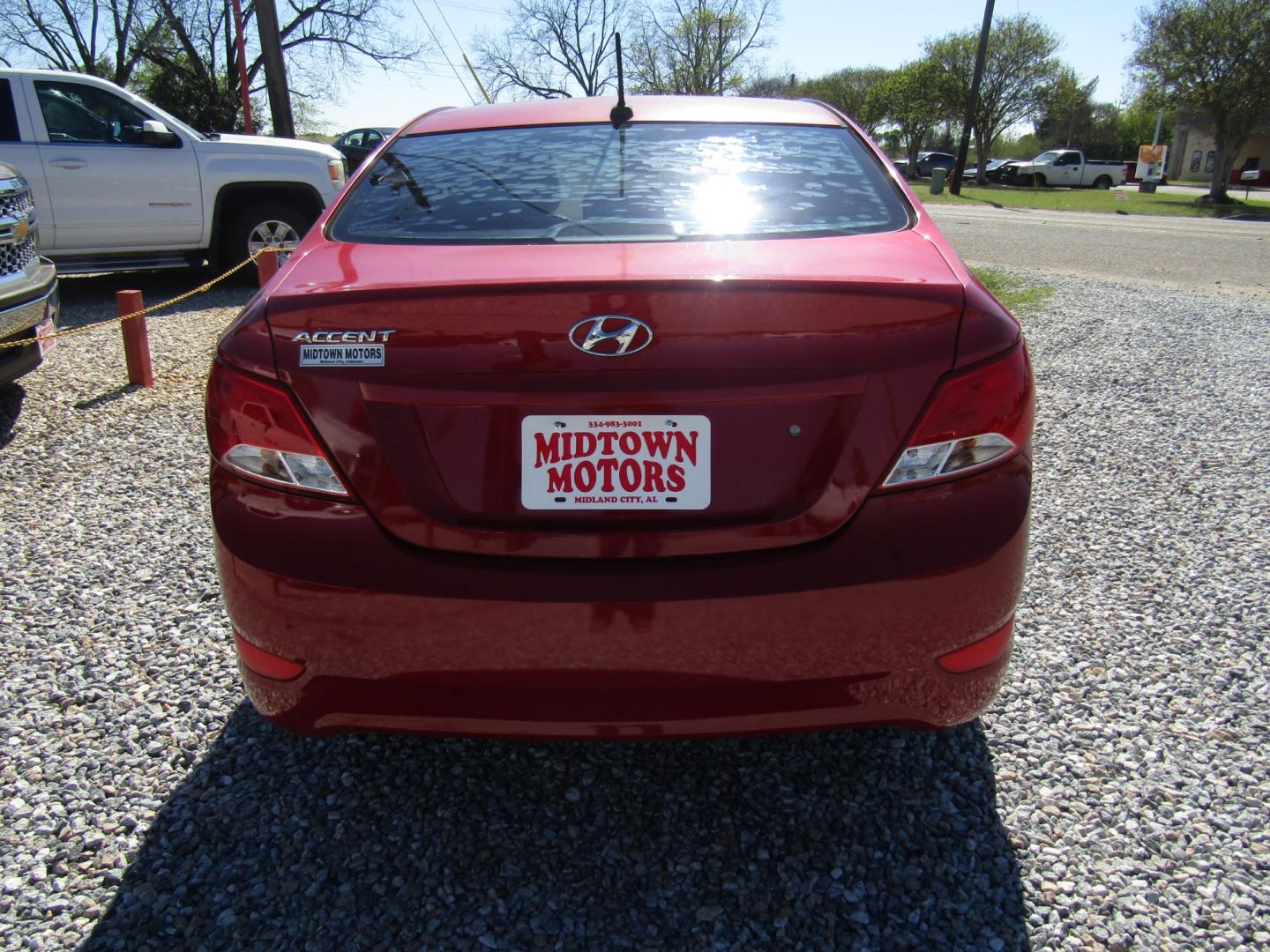 2015 Red /Gray Hyundai Accent GLS 4-Door 6A (KMHCT4AE0FU) with an 1.6L L4 DOHC 16V engine, Automatic transmission, located at 15016 S Hwy 231, Midland City, AL, 36350, (334) 983-3001, 31.306210, -85.495277 - Photo#6