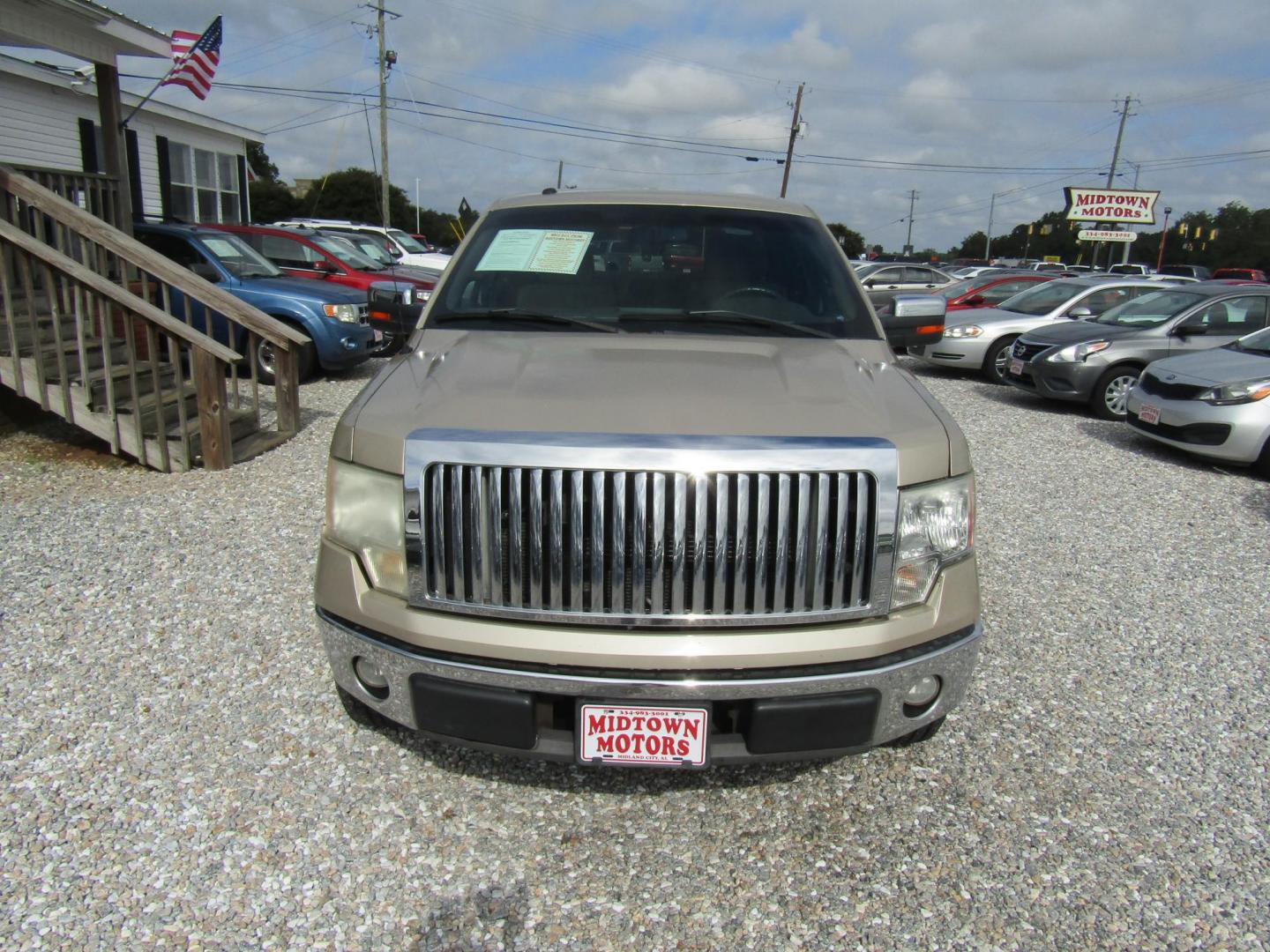 2010 Gold Ford F-150 Lariat SuperCab 6.5-ft. Bed 2WD (1FTEX1C87AF) with an 4.6L V8 SOHC 24V engine, Automatic transmission, located at 15016 S Hwy 231, Midland City, AL, 36350, (334) 983-3001, 31.306210, -85.495277 - Photo#1