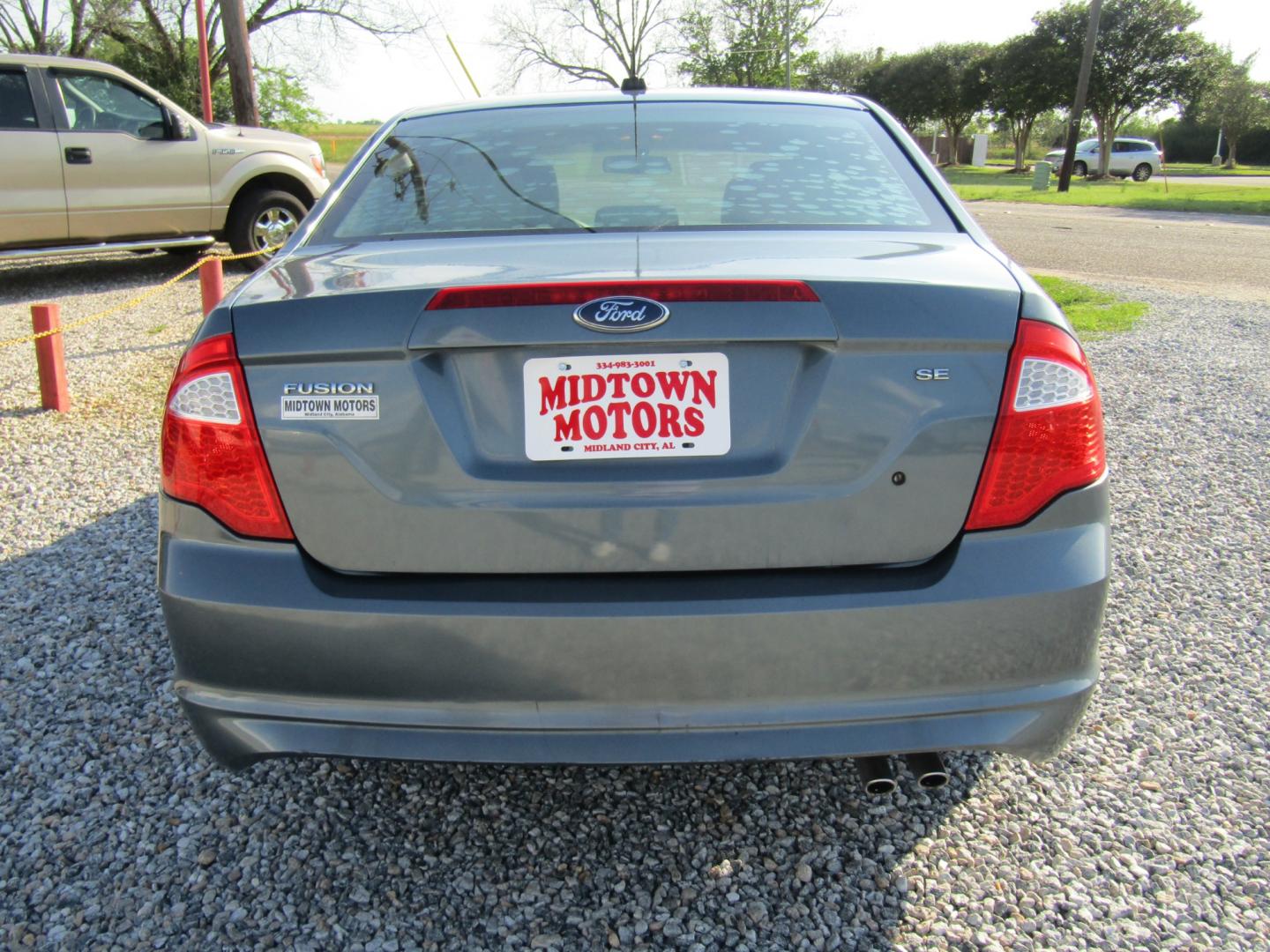 2011 Blue /TAN Ford Fusion I4 SE (3FAHP0HA9BR) with an 2.5L L4 DOHC 16V engine, Automatic transmission, located at 15016 S Hwy 231, Midland City, AL, 36350, (334) 983-3001, 31.306210, -85.495277 - Photo#6