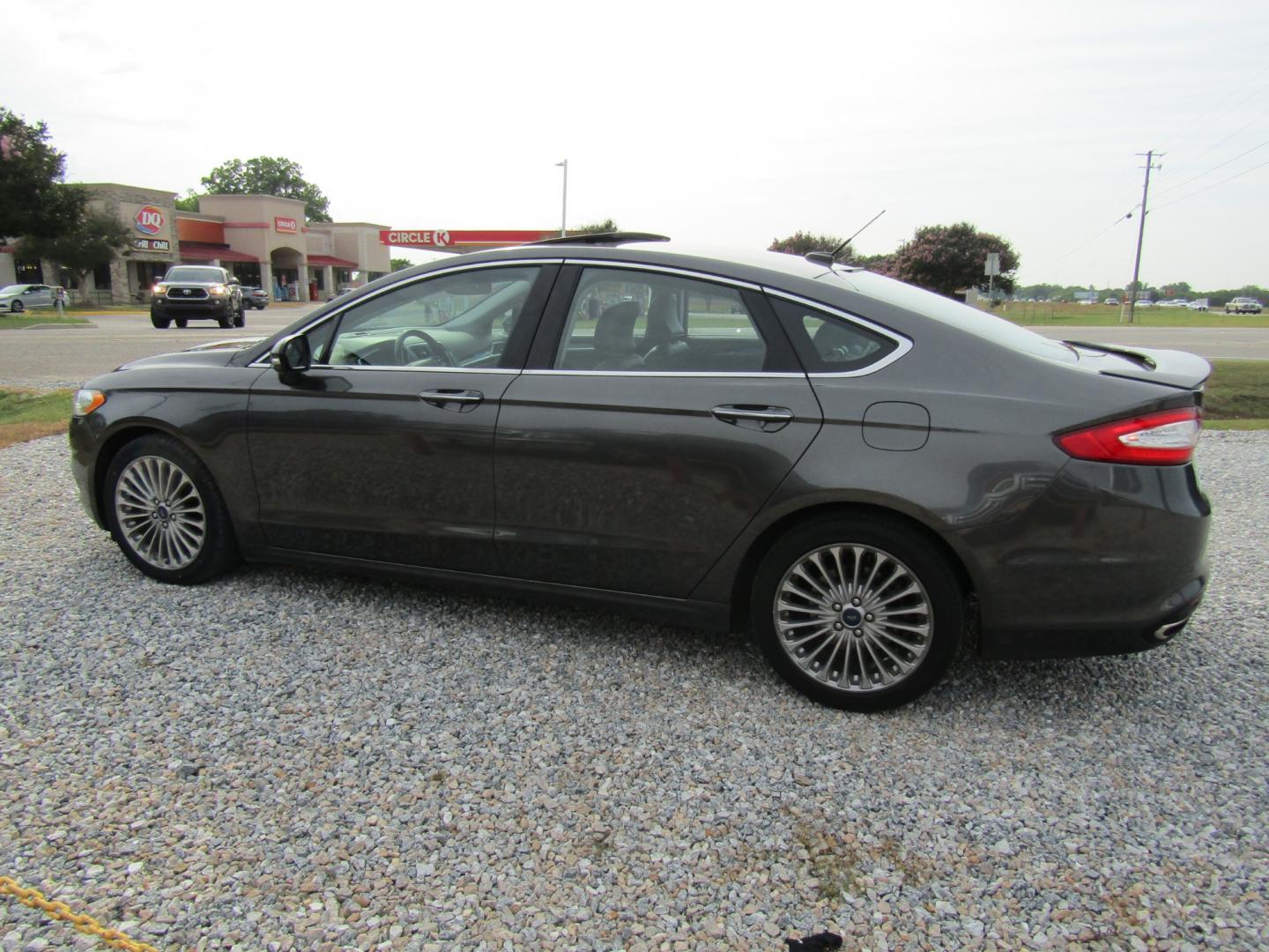 2016 Gray Ford Fusion Titanium (3FA6P0K97GR) with an 2.0L L4 DOHC 16V engine, Automatic transmission, located at 15016 S Hwy 231, Midland City, AL, 36350, (334) 983-3001, 31.306210, -85.495277 - Photo#5