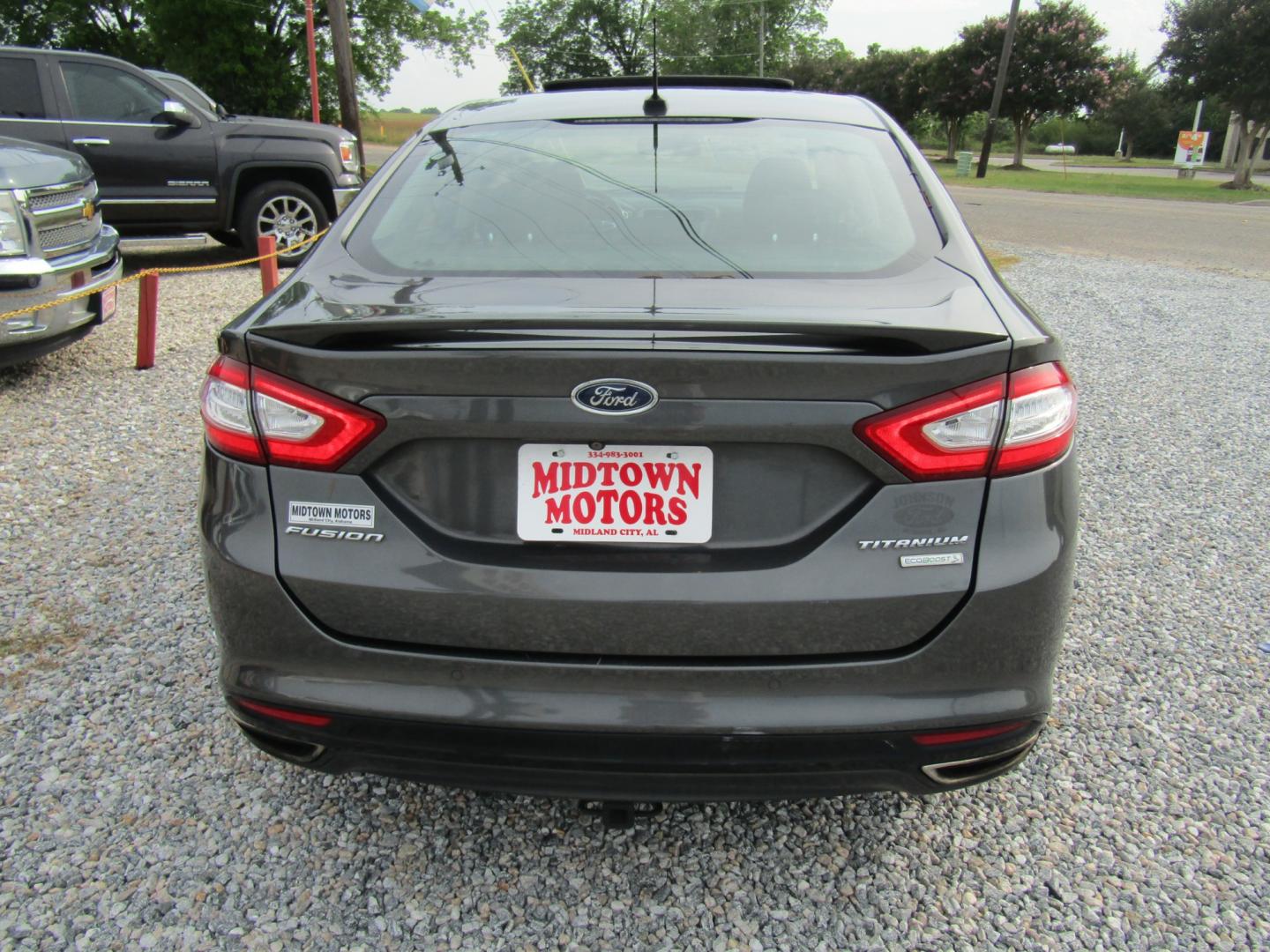 2016 Gray Ford Fusion Titanium (3FA6P0K97GR) with an 2.0L L4 DOHC 16V engine, Automatic transmission, located at 15016 S Hwy 231, Midland City, AL, 36350, (334) 983-3001, 31.306210, -85.495277 - Photo#6