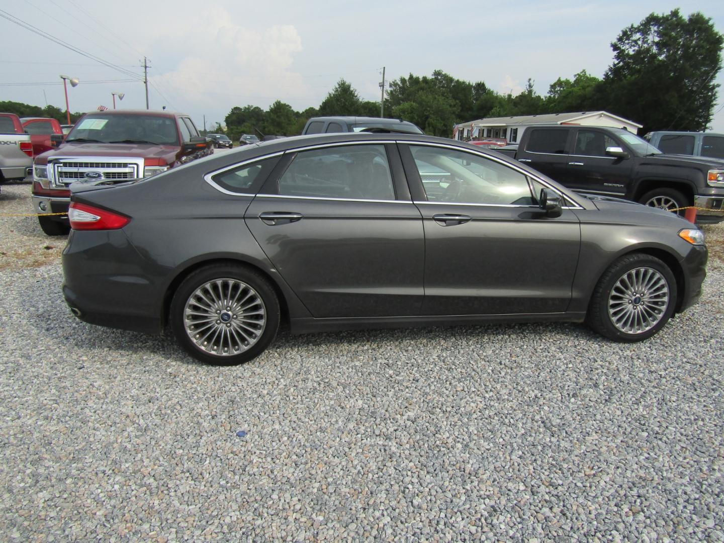 2016 Gray Ford Fusion Titanium (3FA6P0K97GR) with an 2.0L L4 DOHC 16V engine, Automatic transmission, located at 15016 S Hwy 231, Midland City, AL, 36350, (334) 983-3001, 31.306210, -85.495277 - Photo#7