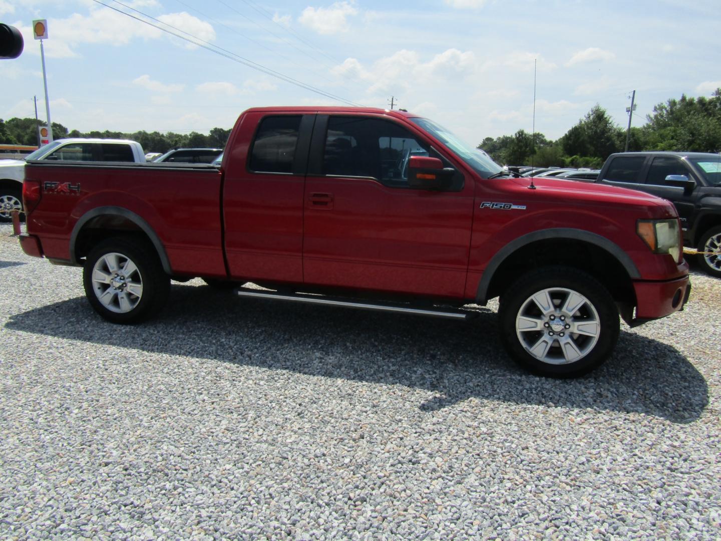 2010 Red Ford F-150 FX4 SuperCab 6.5-ft. Bed 4WD (1FTFX1EV3AK) with an 5.4L V8 SOHC 24V FFV engine, Automatic transmission, located at 15016 S Hwy 231, Midland City, AL, 36350, (334) 983-3001, 31.306210, -85.495277 - Photo#0