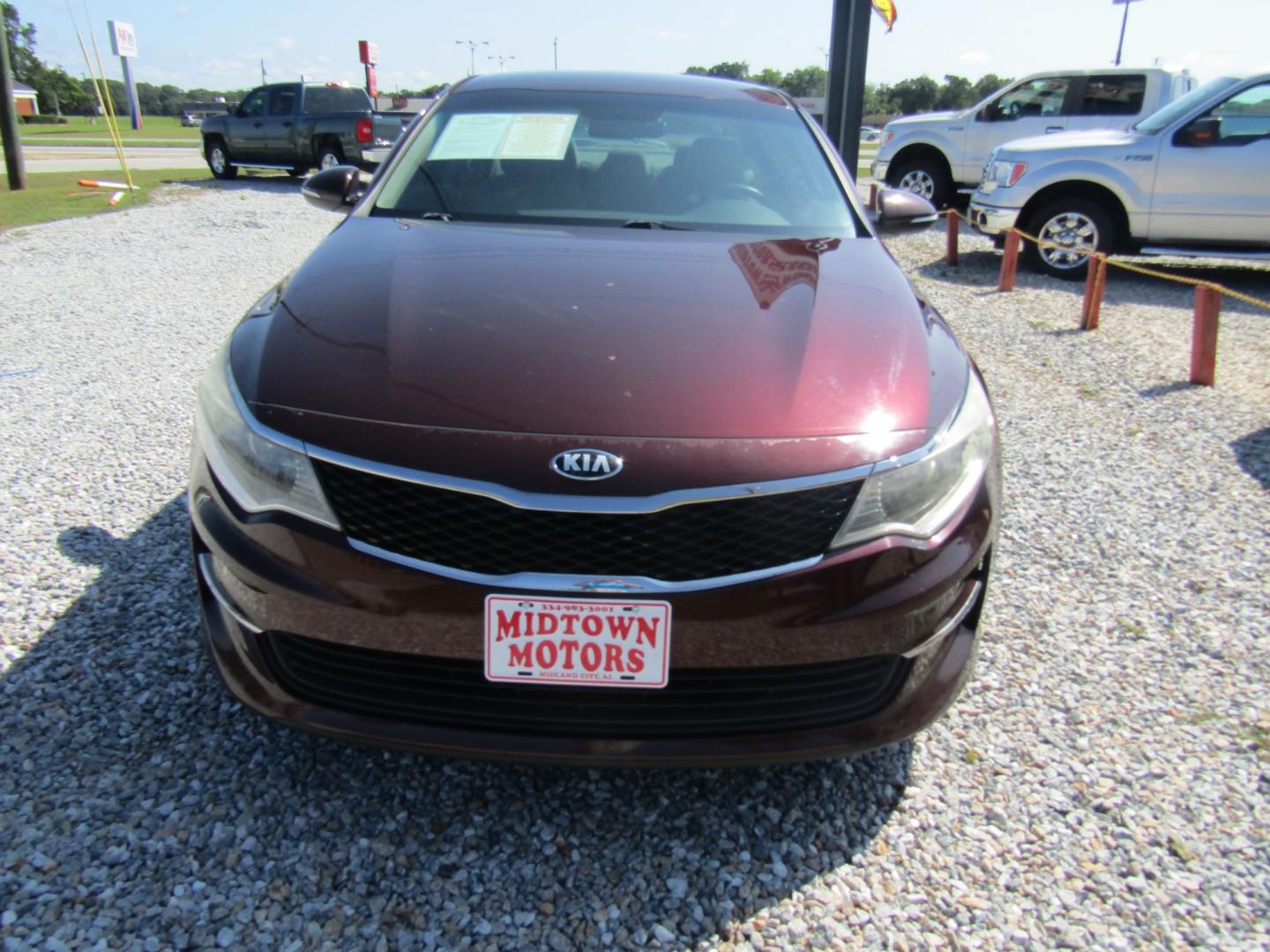 2016 Maroon /Tan Kia Optima LX (5XXGT4L35GG) with an 2.4L L4 DOHC 16V engine, Automatic transmission, located at 15016 S Hwy 231, Midland City, AL, 36350, (334) 983-3001, 31.306210, -85.495277 - Photo#1