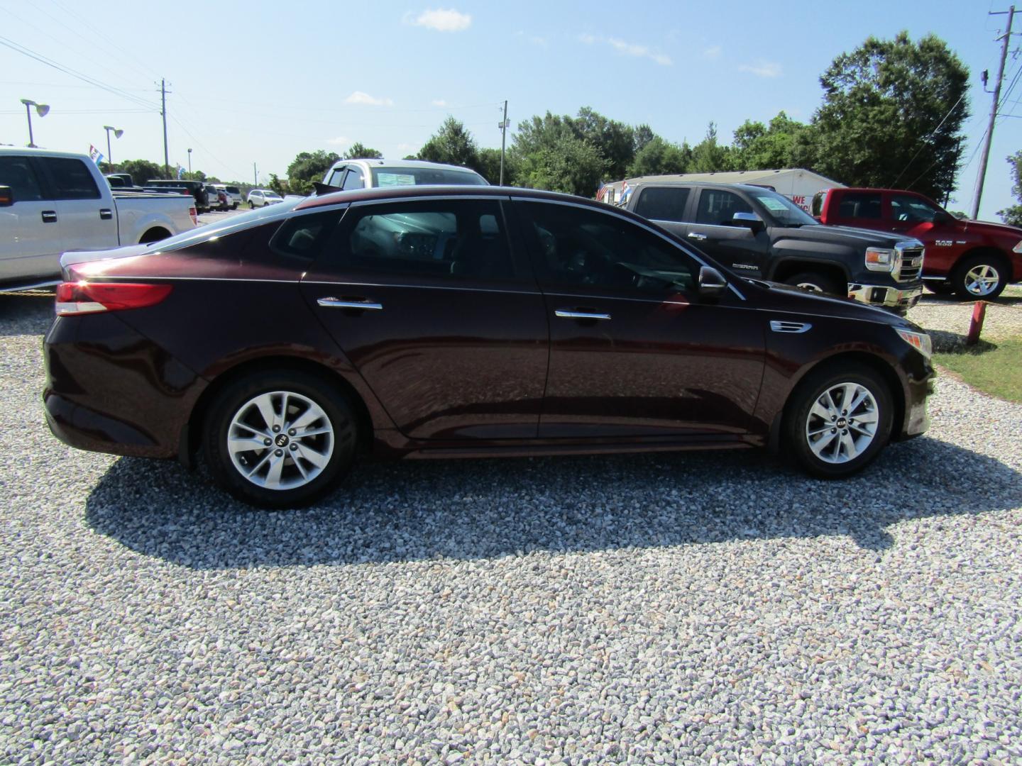 2016 Maroon /Tan Kia Optima LX (5XXGT4L35GG) with an 2.4L L4 DOHC 16V engine, Automatic transmission, located at 15016 S Hwy 231, Midland City, AL, 36350, (334) 983-3001, 31.306210, -85.495277 - Photo#7