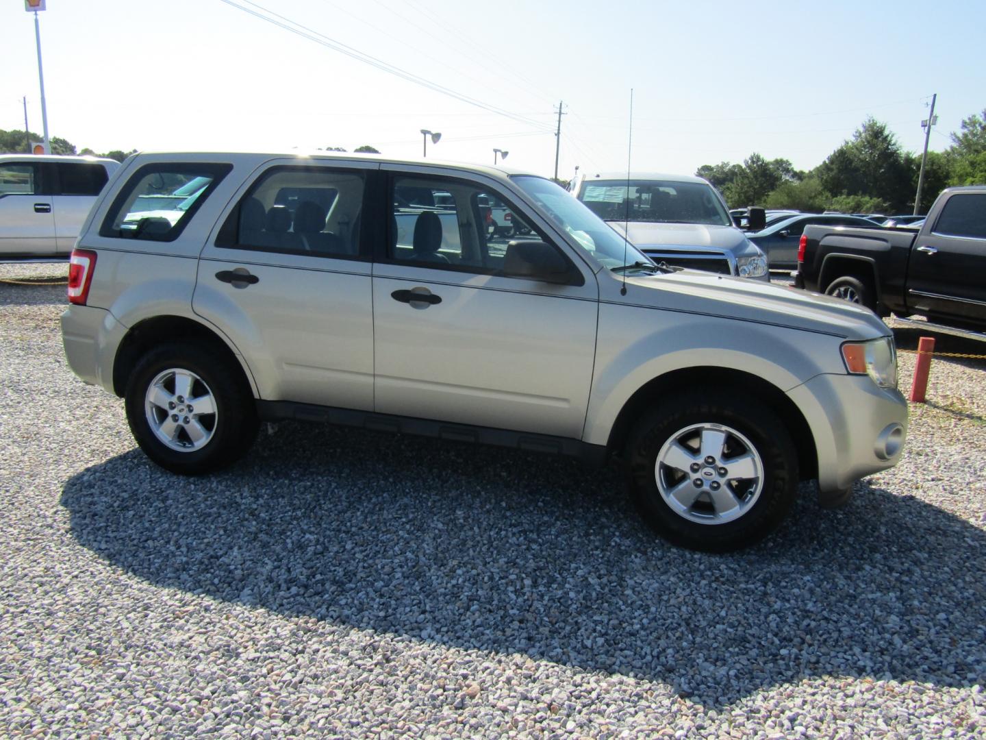 2010 Gold Ford Escape XLS FWD (1FMCU0C76AK) with an 2.5L L4 DOHC 16V engine, Automatic transmission, located at 15016 S Hwy 231, Midland City, AL, 36350, (334) 983-3001, 31.306210, -85.495277 - Photo#0