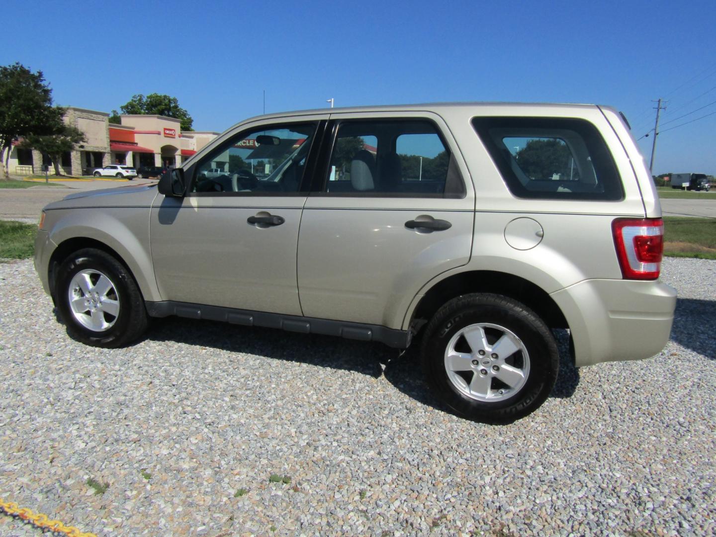 2010 Gold Ford Escape XLS FWD (1FMCU0C76AK) with an 2.5L L4 DOHC 16V engine, Automatic transmission, located at 15016 S Hwy 231, Midland City, AL, 36350, (334) 983-3001, 31.306210, -85.495277 - Photo#5