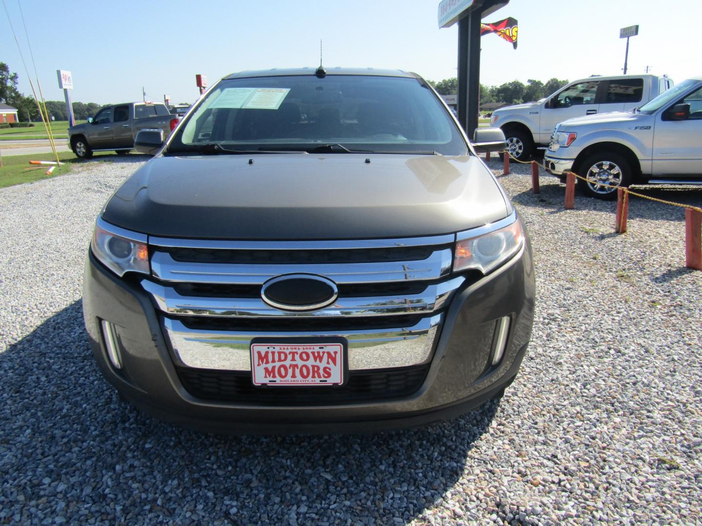 2013 Brown Ford Edge SEL FWD (2FMDK3JC2DB) with an 3.5L V6 DOHC 24V engine, Automatic transmission, located at 15016 S Hwy 231, Midland City, AL, 36350, (334) 983-3001, 31.306210, -85.495277 - Photo#1