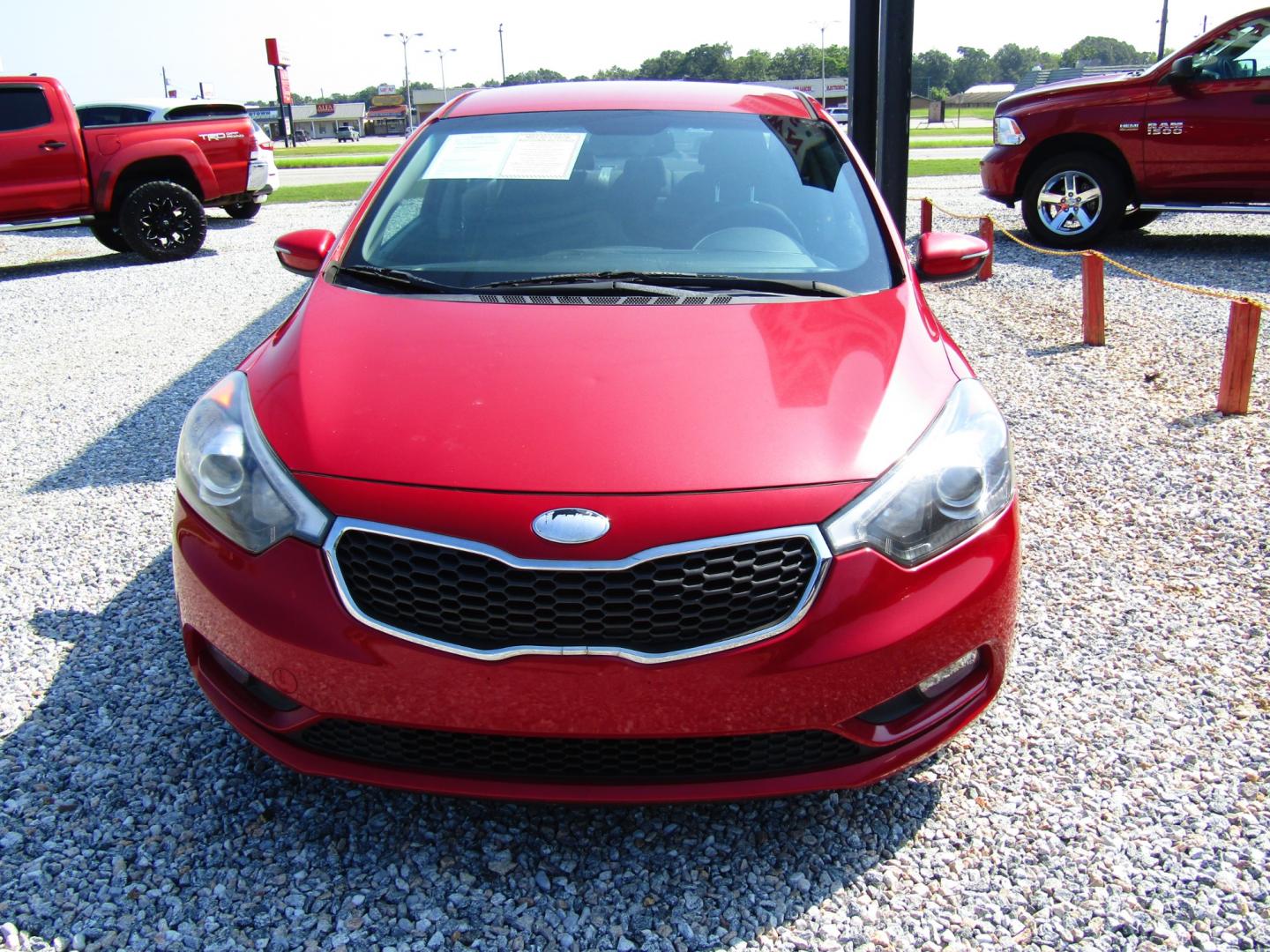 2014 Red Kia Forte EX (KNAFX4A80E5) with an 2.0L L4 DOHC 16V engine, Automatic transmission, located at 15016 S Hwy 231, Midland City, AL, 36350, (334) 983-3001, 31.306210, -85.495277 - Photo#1