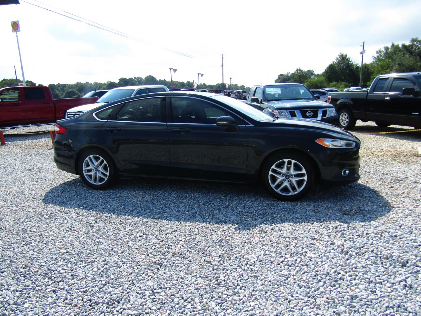 2013 Black /Black Ford Fusion SE (3FA6P0HR8DR) with an 1.6L L4 DOHC 16V engine, Automatic transmission, located at 15016 S Hwy 231, Midland City, AL, 36350, (334) 983-3001, 31.306210, -85.495277 - Photo#0