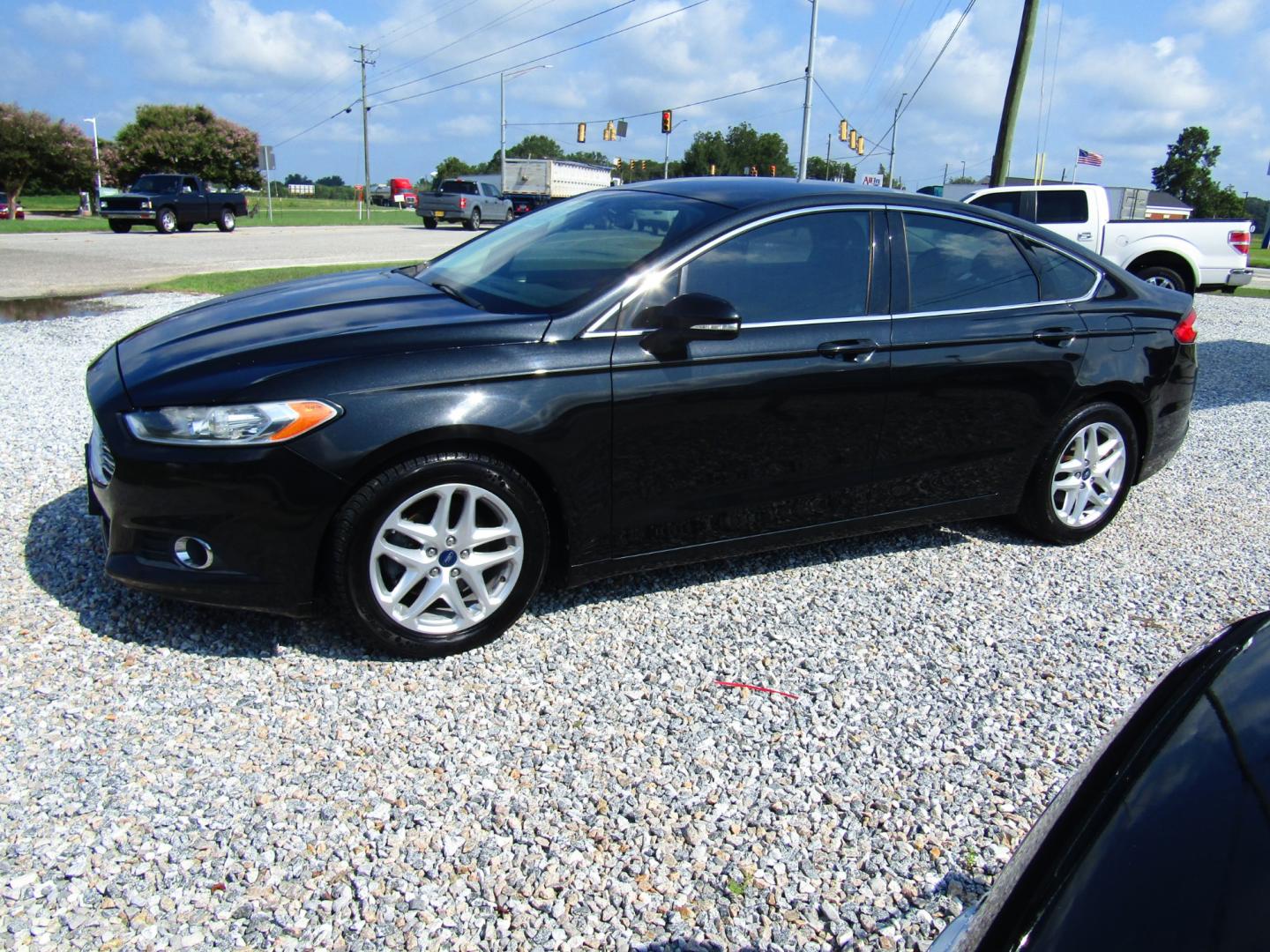 2013 Black /Black Ford Fusion SE (3FA6P0HR8DR) with an 1.6L L4 DOHC 16V engine, Automatic transmission, located at 15016 S Hwy 231, Midland City, AL, 36350, (334) 983-3001, 31.306210, -85.495277 - Photo#2