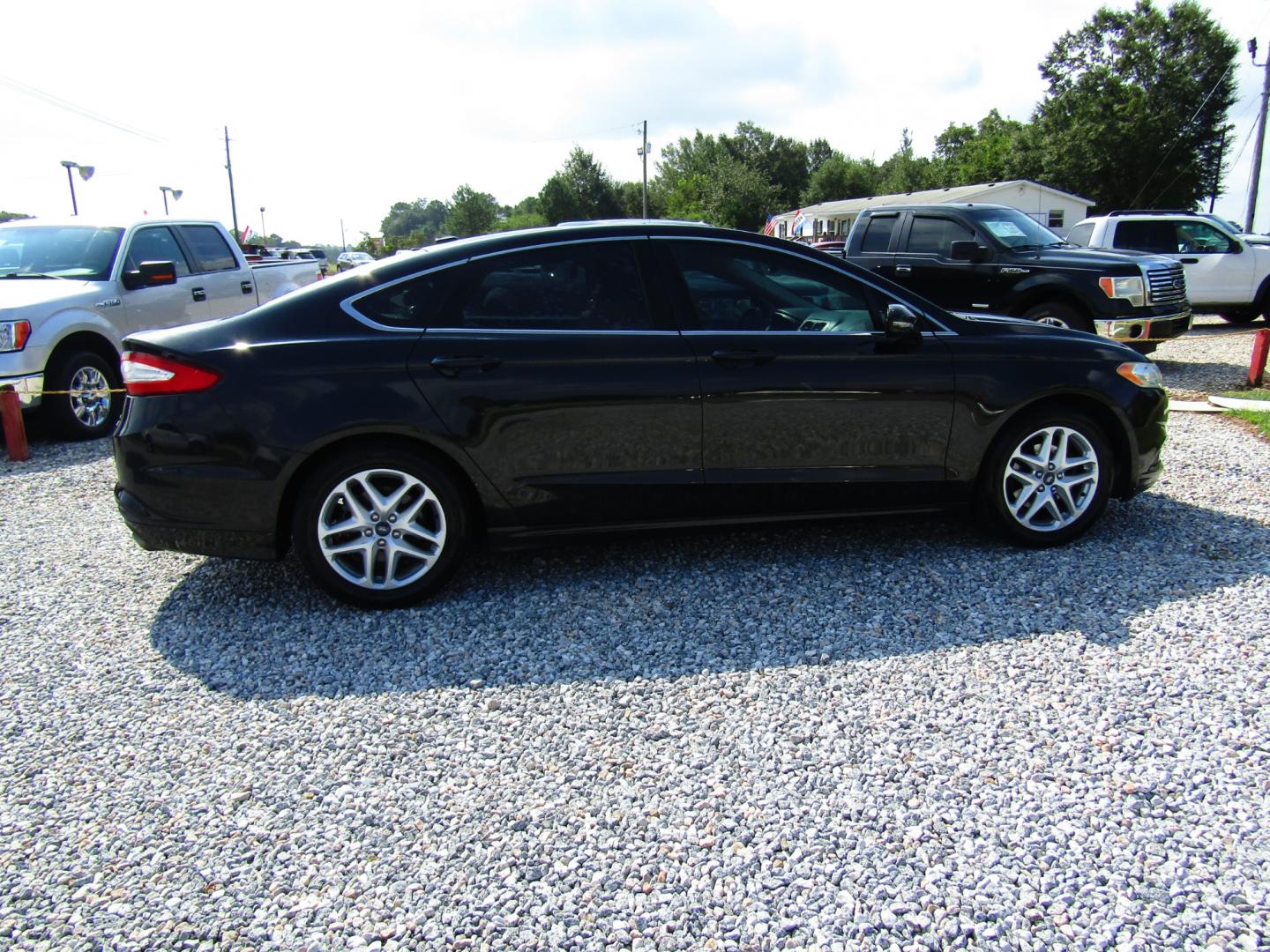 2013 Black /Black Ford Fusion SE (3FA6P0HR8DR) with an 1.6L L4 DOHC 16V engine, Automatic transmission, located at 15016 S Hwy 231, Midland City, AL, 36350, (334) 983-3001, 31.306210, -85.495277 - Photo#7