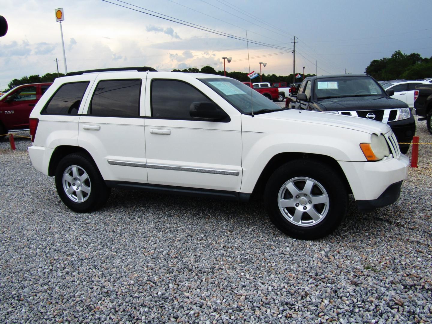 2010 WHITE /Black Jeep Grand Cherokee Laredo 2WD (1J4PS4GK9AC) with an 3.7L V6 SOHC 12V engine, Automatic transmission, located at 15016 S Hwy 231, Midland City, AL, 36350, (334) 983-3001, 31.306210, -85.495277 - Photo#0