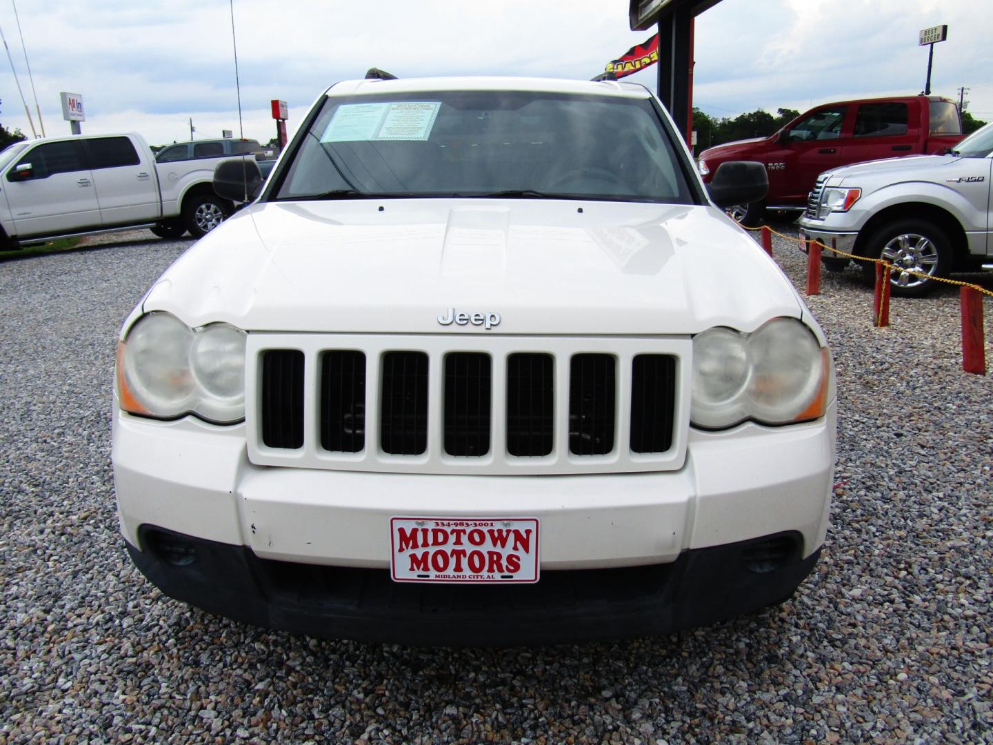 2010 WHITE /Black Jeep Grand Cherokee Laredo 2WD (1J4PS4GK9AC) with an 3.7L V6 SOHC 12V engine, Automatic transmission, located at 15016 S Hwy 231, Midland City, AL, 36350, (334) 983-3001, 31.306210, -85.495277 - Photo#1