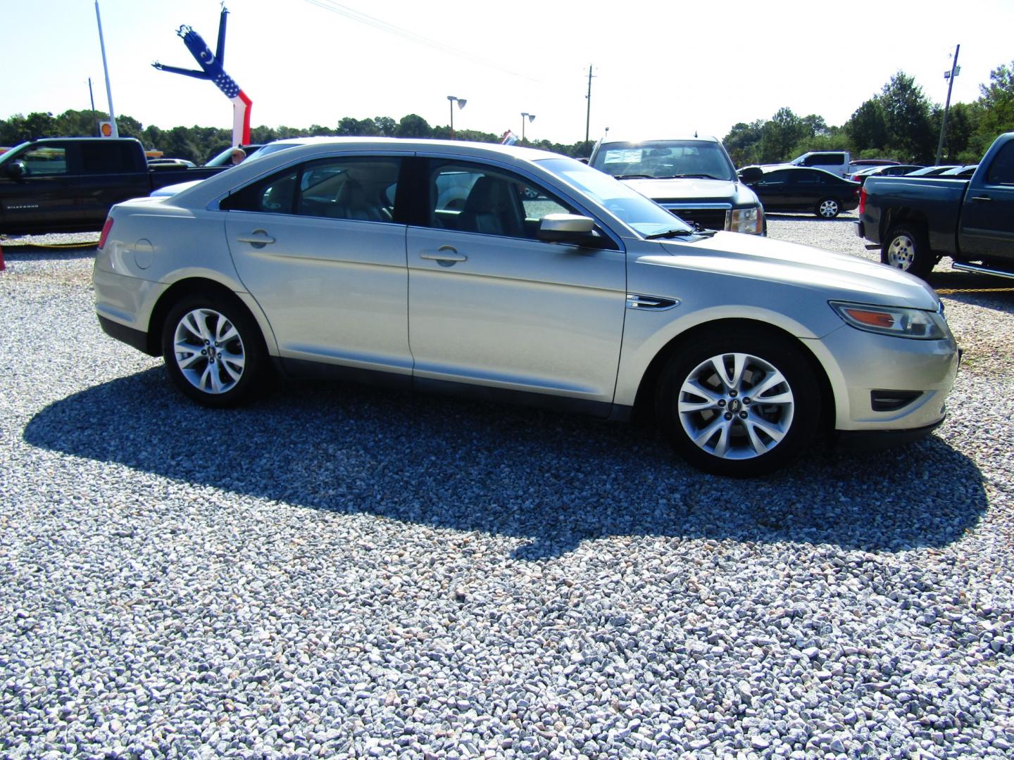 2011 Gold /Tan Ford Taurus SEL FWD (1FAHP2EW4BG) with an 3.5L V6 DOHC 24V engine, Automatic transmission, located at 15016 S Hwy 231, Midland City, AL, 36350, (334) 983-3001, 31.306210, -85.495277 - Photo#0