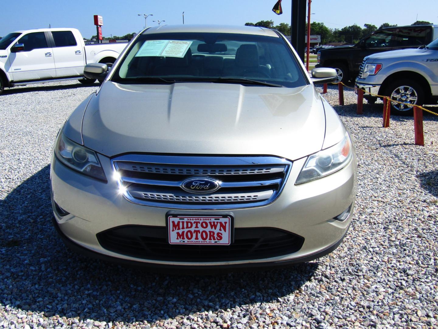 2011 Gold /Tan Ford Taurus SEL FWD (1FAHP2EW4BG) with an 3.5L V6 DOHC 24V engine, Automatic transmission, located at 15016 S Hwy 231, Midland City, AL, 36350, (334) 983-3001, 31.306210, -85.495277 - Photo#1