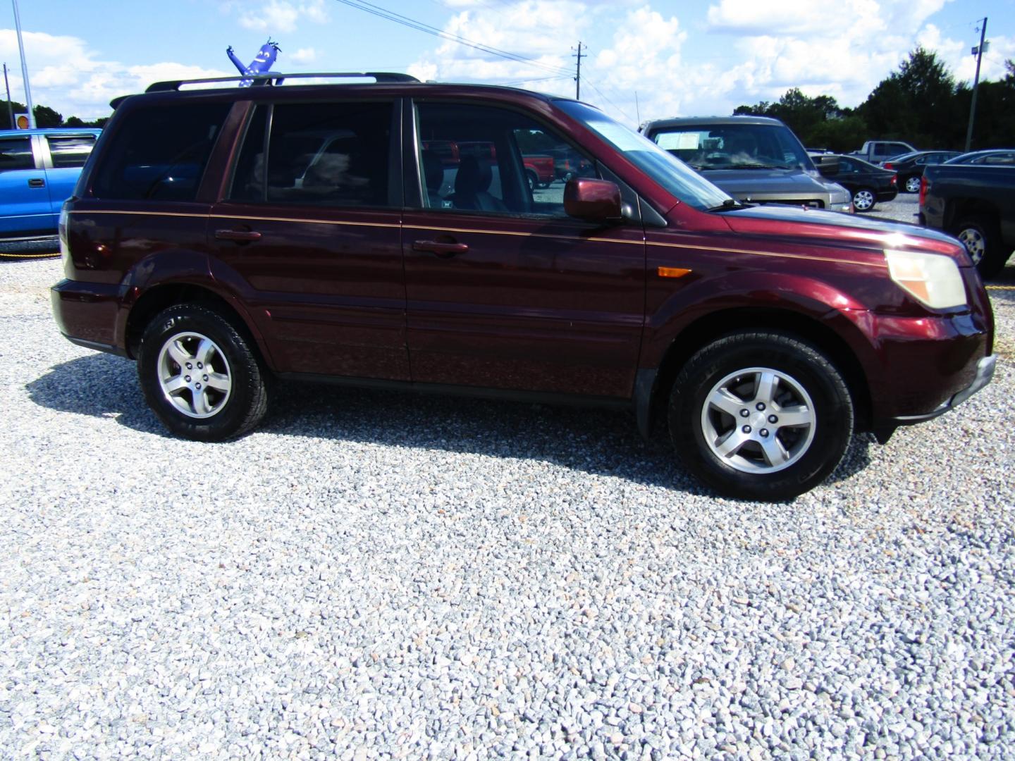 2007 Maroon /Gray Honda Pilot EX-L 2WD w/ DVD (5FNYF28667B) with an 3.5L V6 SOHC 24V engine, Automatic transmission, located at 15016 S Hwy 231, Midland City, AL, 36350, (334) 983-3001, 31.306210, -85.495277 - Photo#0