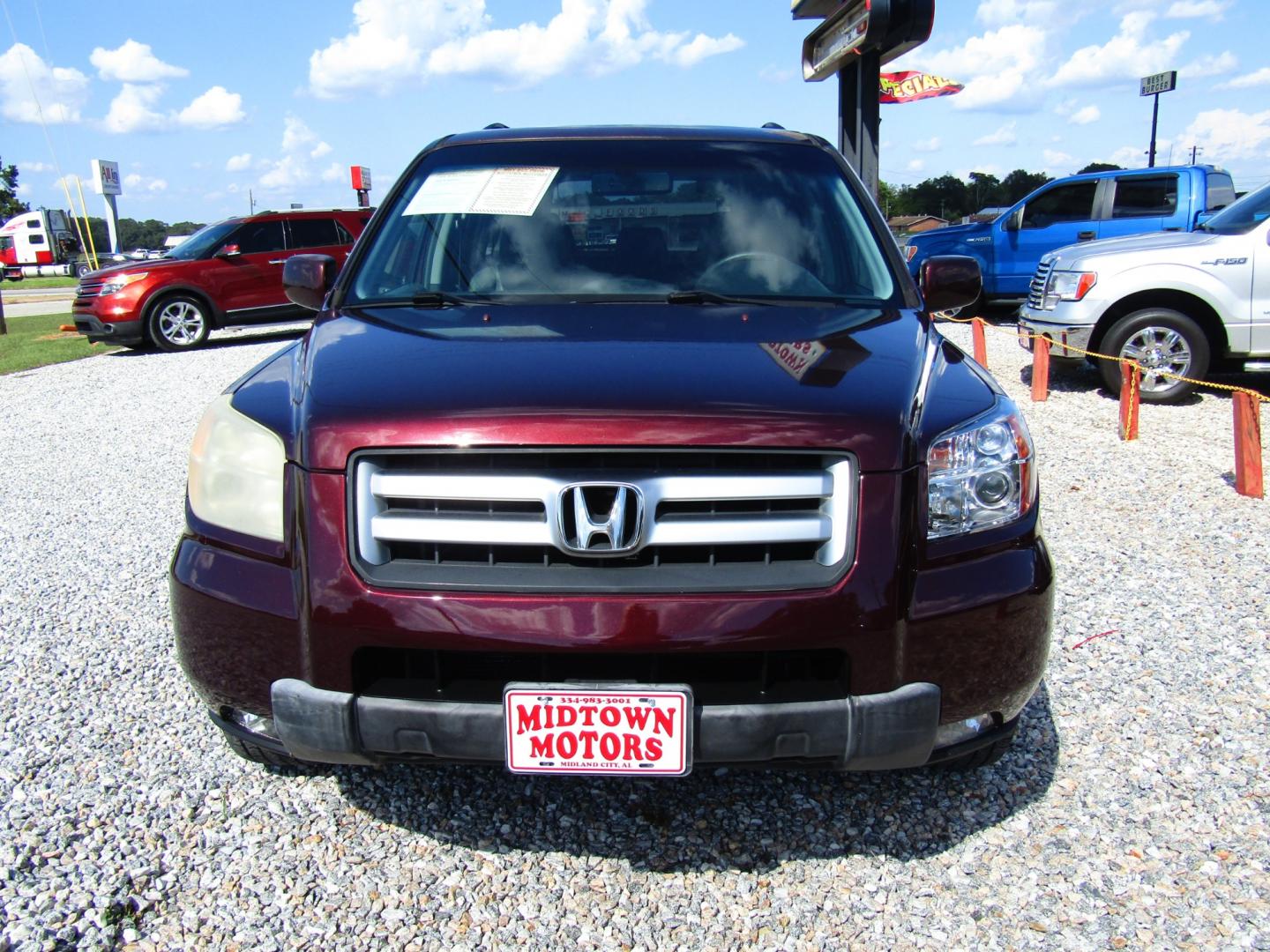 2007 Maroon /Gray Honda Pilot EX-L 2WD w/ DVD (5FNYF28667B) with an 3.5L V6 SOHC 24V engine, Automatic transmission, located at 15016 S Hwy 231, Midland City, AL, 36350, (334) 983-3001, 31.306210, -85.495277 - Photo#1