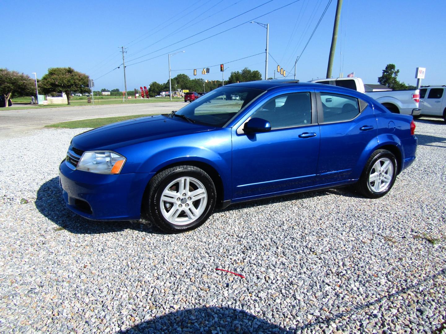 2013 Blue Dodge Avenger SXT (1C3CDZCG6DN) with an 3.6L V6 DOHC 24V FFV engine, Automatic transmission, located at 15016 S Hwy 231, Midland City, AL, 36350, (334) 983-3001, 31.306210, -85.495277 - Photo#2