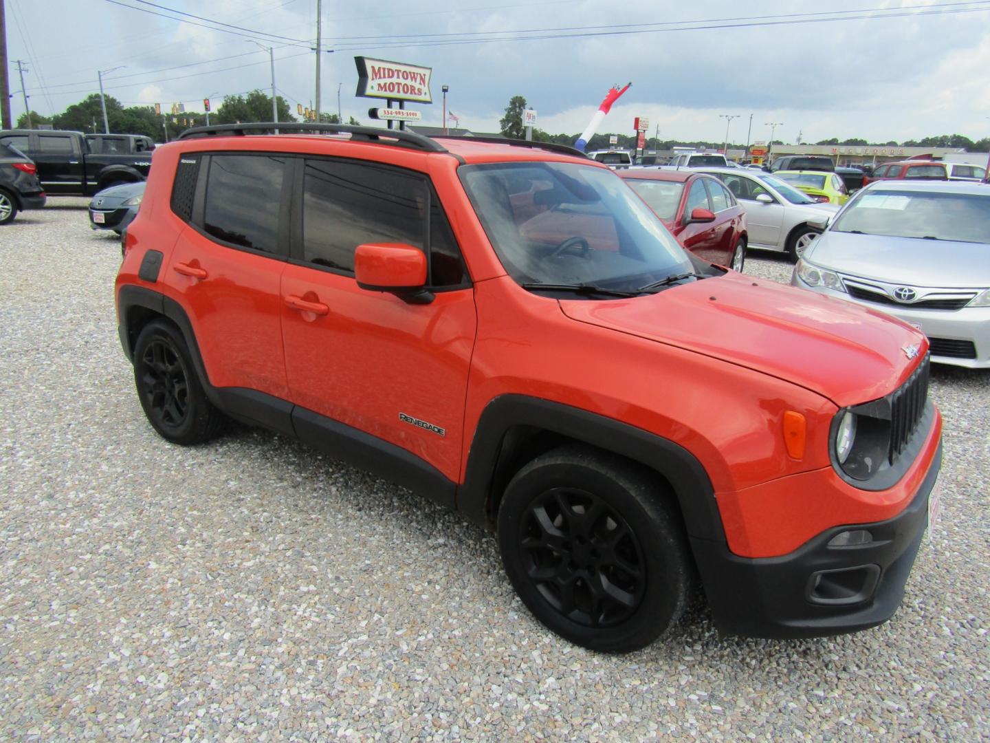 2015 Orange Jeep Renegade Latitude FWD (ZACCJABT8FP) with an 2.4L L4 engine, Automatic transmission, located at 15016 S Hwy 231, Midland City, AL, 36350, (334) 983-3001, 31.306210, -85.495277 - Photo#0