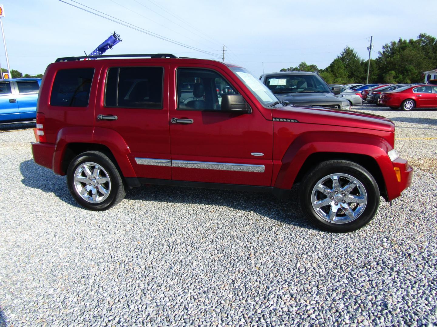 2012 Red /Black Jeep Liberty Sport 2WD (1C4PJLAK6CW) with an 3.7L V6 SOHC 12V engine, Automatic transmission, located at 15016 S Hwy 231, Midland City, AL, 36350, (334) 983-3001, 31.306210, -85.495277 - Photo#0