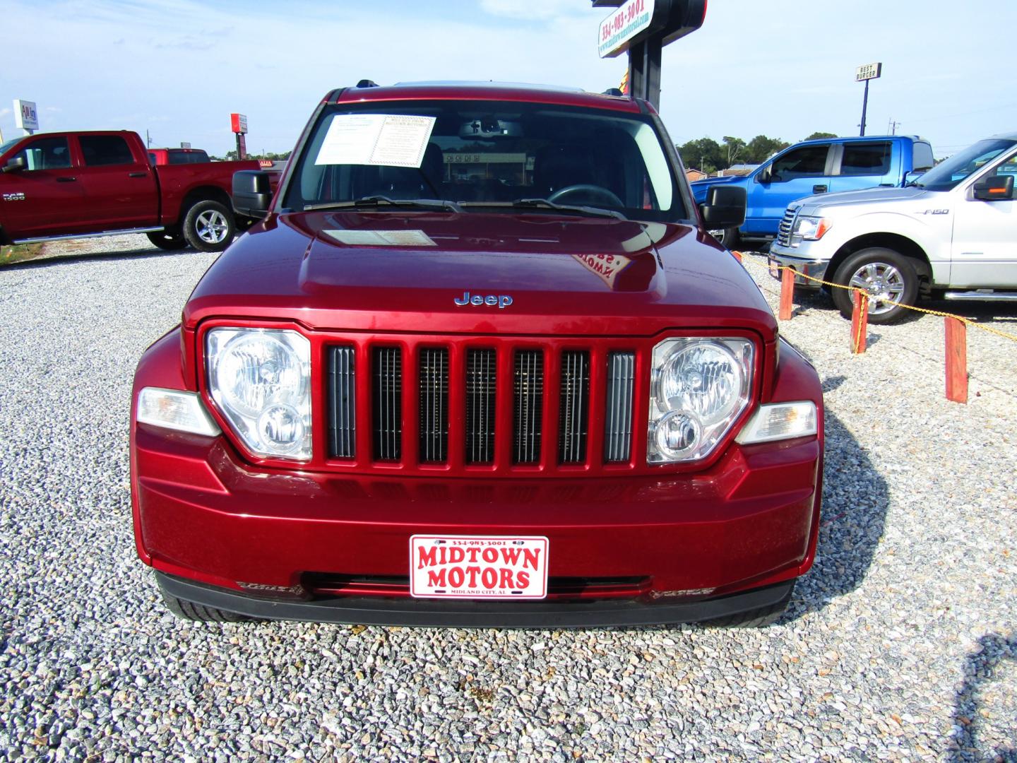 2012 Red /Black Jeep Liberty Sport 2WD (1C4PJLAK6CW) with an 3.7L V6 SOHC 12V engine, Automatic transmission, located at 15016 S Hwy 231, Midland City, AL, 36350, (334) 983-3001, 31.306210, -85.495277 - Photo#1